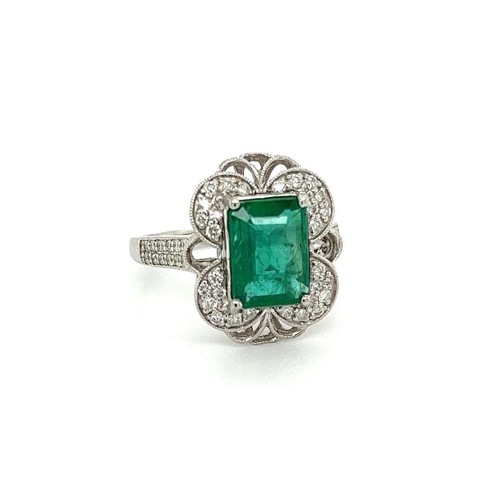 Simply Beautiful! Finely detailed Vintage Designer Emerald Cut GIA Emerald and Diamond Platinum Cocktail Ring. Centering a securely Emerald-Cut Emerald, weighing approx. 2.32 Carats, GIA # 6234039049, Zambian F2. Surrounded by Diamonds, weighing