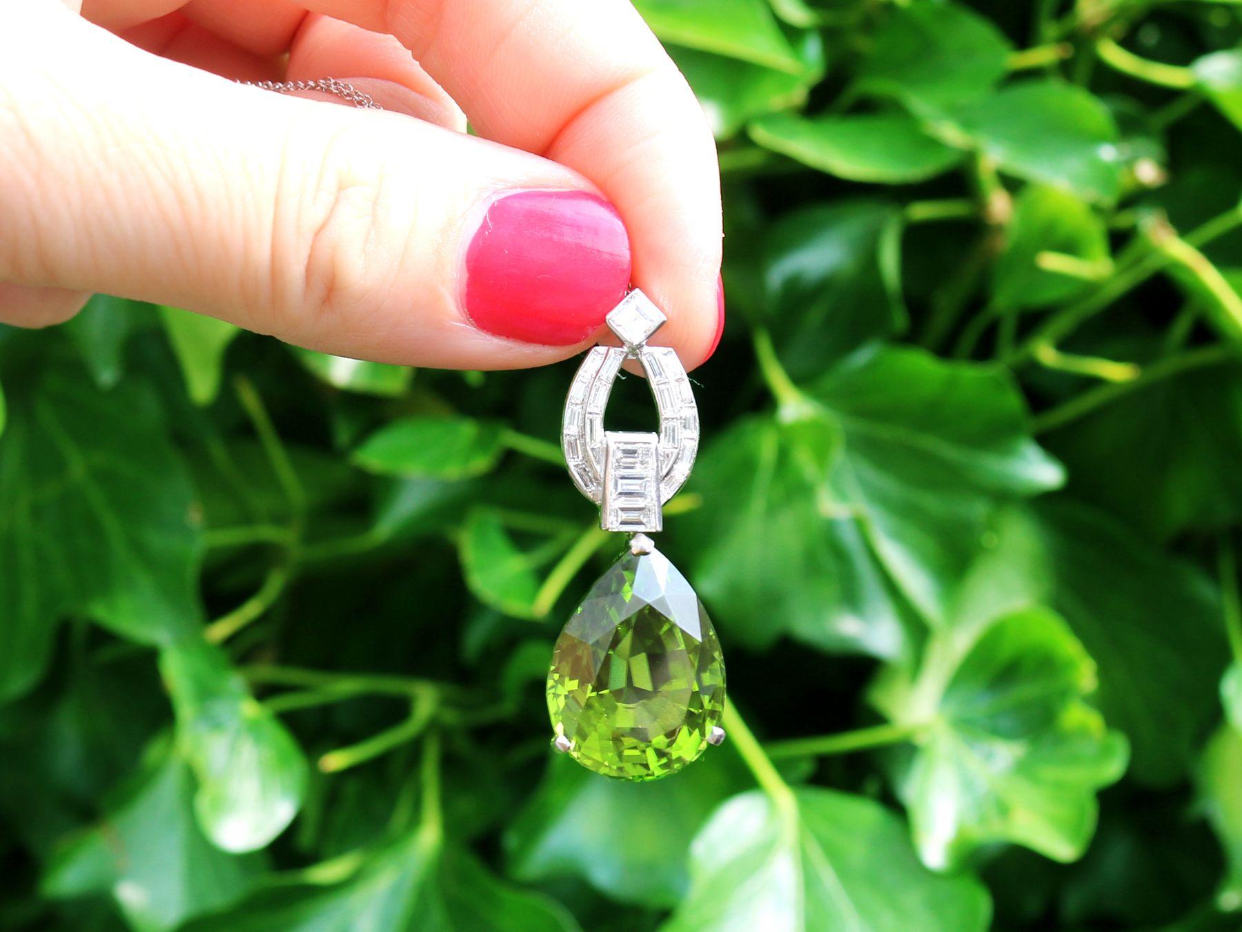 A stunning, fine and impressive vintage 23.20 carat peridot and 1.38 carat diamond, platinum pendant; part of our diverse gemstone jewellery collections.

This stunning, fine and impressive vintage pendant has been crafted in platinum.

The stunning