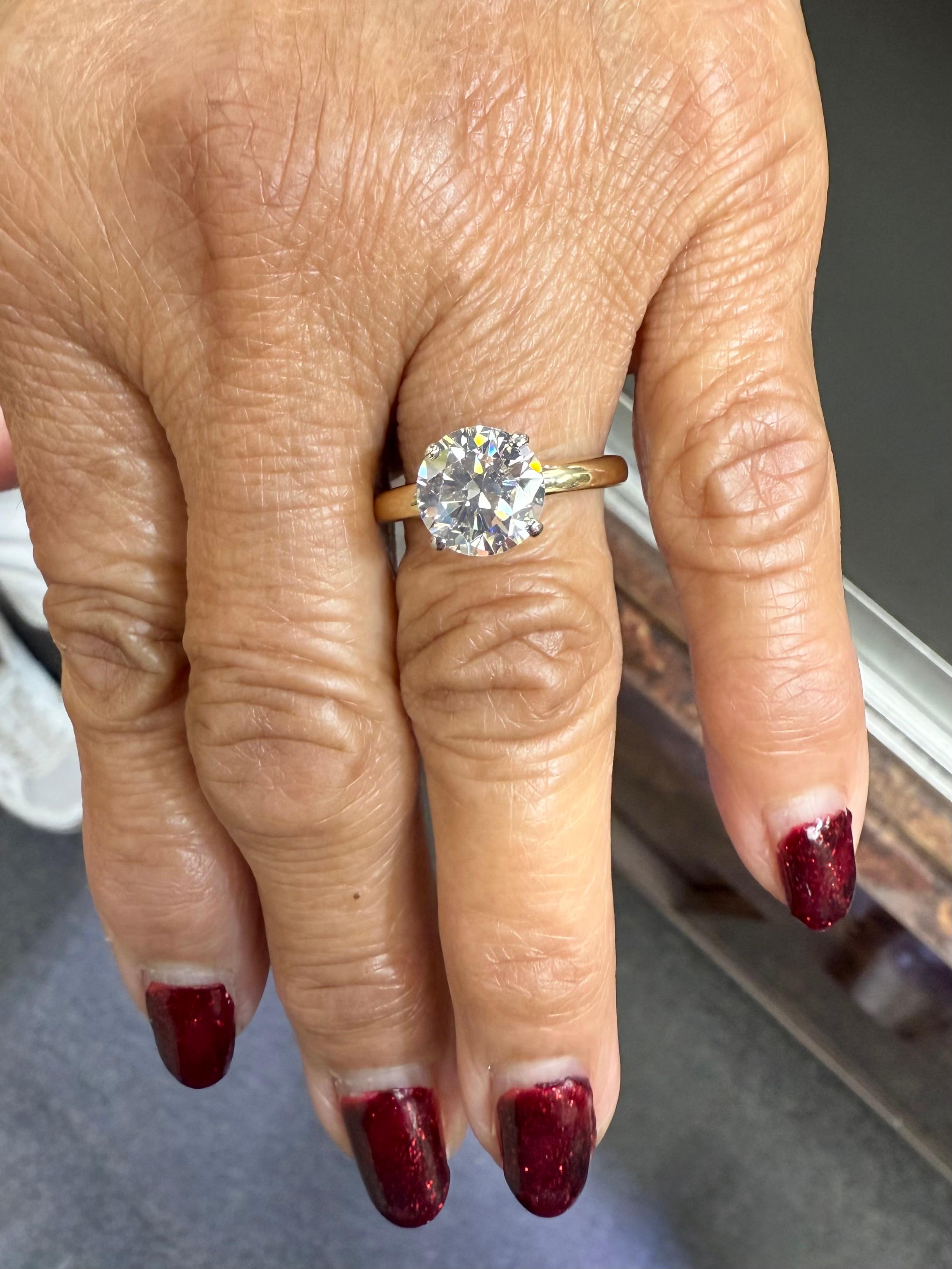 Vintage 2.36 carats solitaire diamond 18k yellow gold platinum engagement ring, circa 1950.

The 2.36 carat diamond is a transitional cut round brilliant diamond,  It is set in a four-prong platinum setting followed by an 18k yellow gold shank.  A