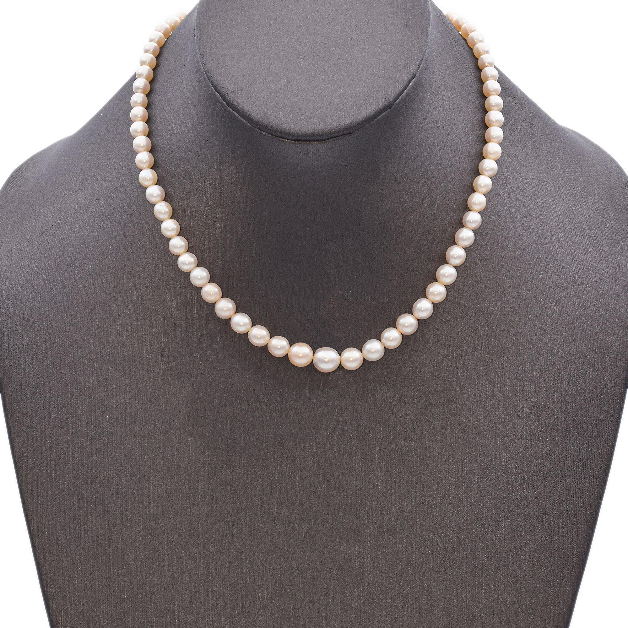 A classic beaded necklace featuring graduated lustrous white pearls.
Crafted with precision, each pearl is meticulously strung to create a seamless and elegant design.
The necklace is secured with a sleek 23K yellow gold clasp, adding a touch of