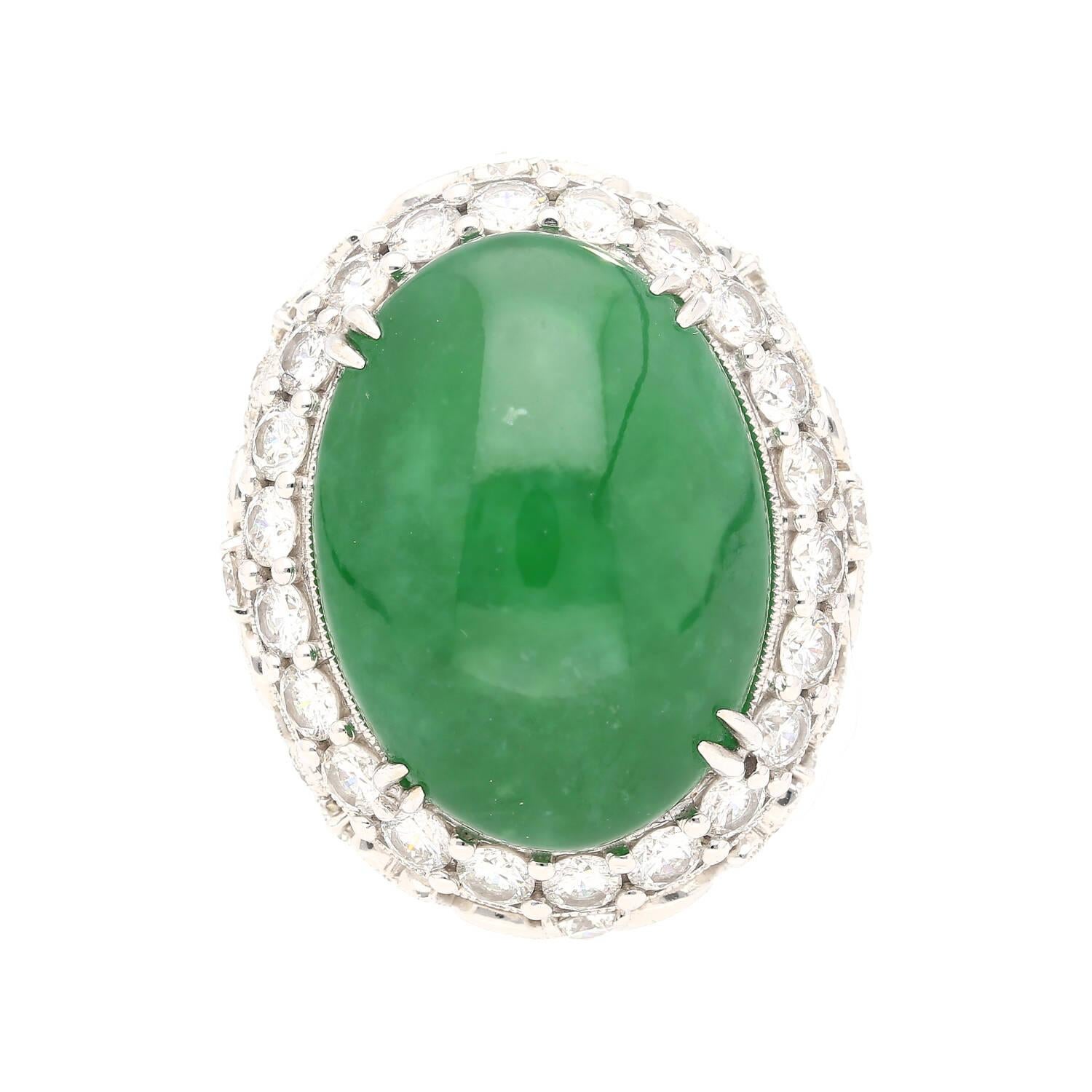Indulge in the elegance and allure of this 24.04 carat Jade and Diamond Halo cocktail ring, expertly crafted in 18K White Gold. Elevate your jewelry collection with this captivating piece that combines the beauty of Jade with the brilliance of