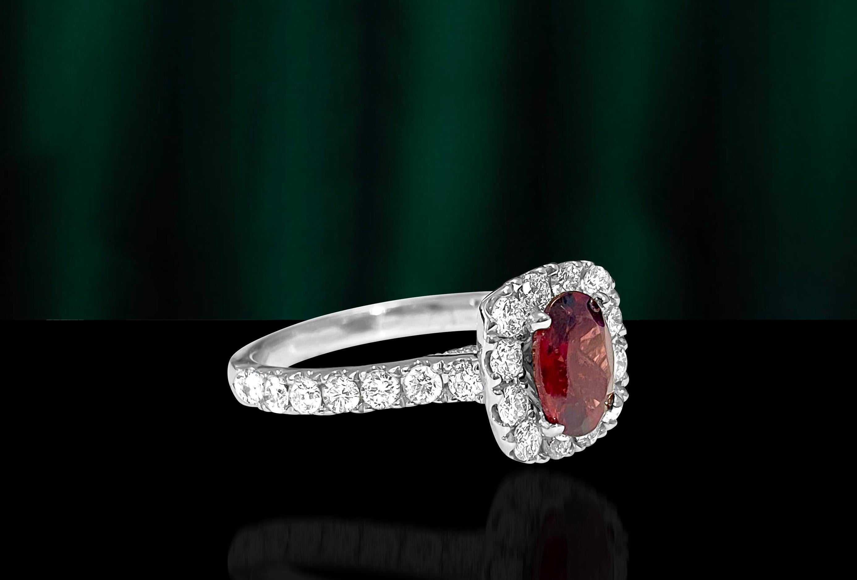 Metal: 14k white gold. 
Diamonds: 1.20cts total. Round brilliant cut. VS-SI clarity. G color. 
Garnet: Oval shape set in prongs. 8x6mm. 1.20cts approx. 
Total carat weight of all gemstonesL 2.40 Carats. 
Total weight of the ring: 4.71 grams