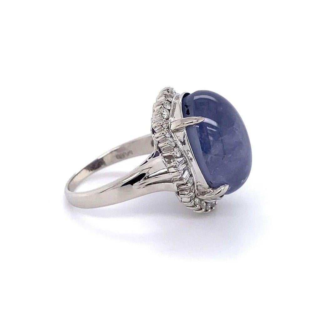 Simply Beautiful! Finely detailed Vintage Awesome Blue Star Sapphire and Diamond Platinum Ring. Centering a securely nestled Hand set Oval Blue Star Sapphire, weighing approx. 24.40 Carats. Surrounded by Diamonds, approx. 0.46tcw. Hand crafted