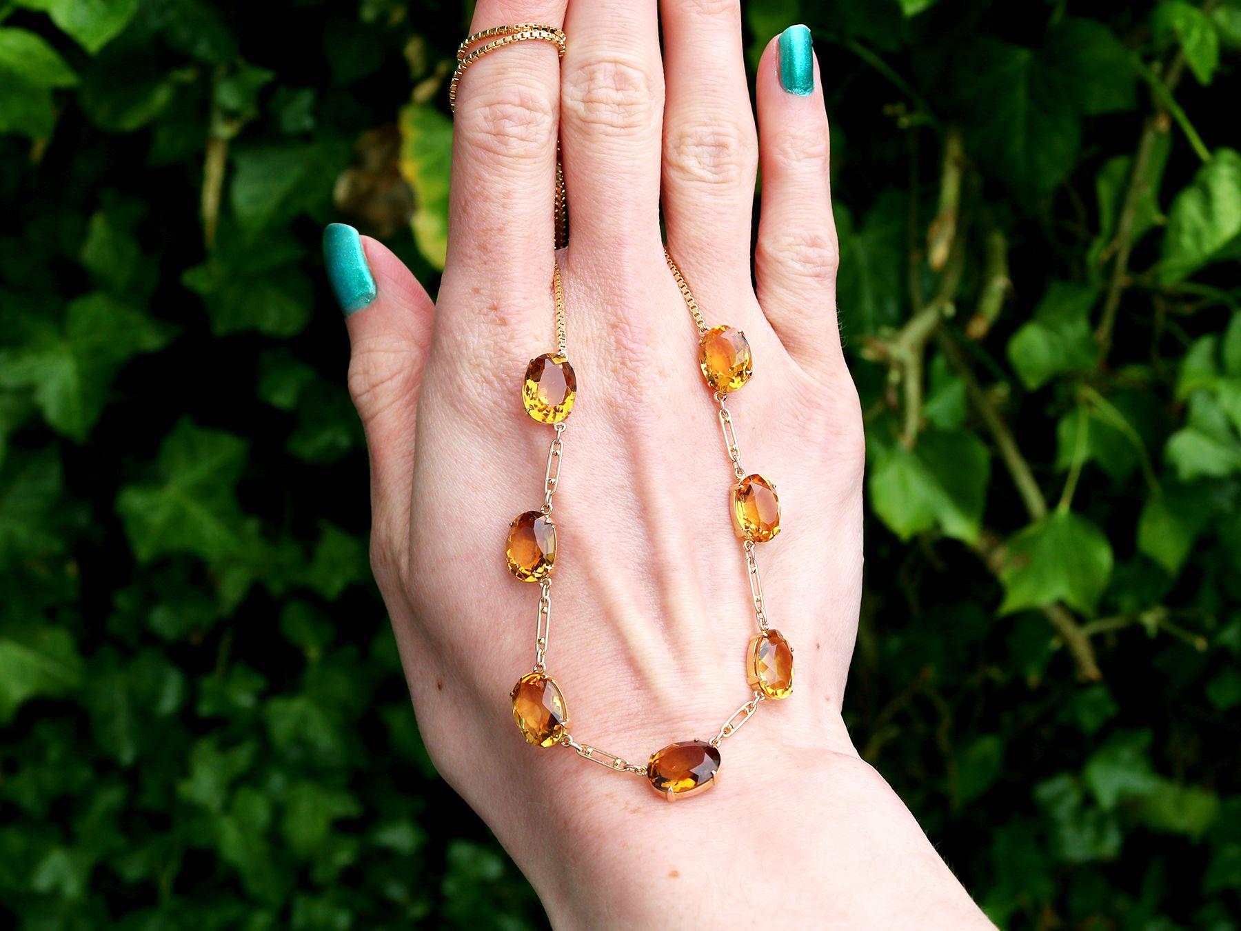 This fine and impressive vintage necklace has been crafted in 9ct yellow gold.

The vintage necklace is ornamented with a total of seven four claw set oval faceted cut citrines, totalling 24.57cts.

The citrine array is conjoined with figaro chain