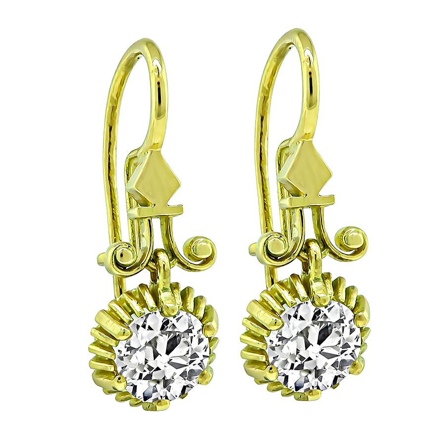 This is an amazing pair of 18k yellow gold earrings from the Victorian era. The earrings feature sparkling old European cut diamonds that weigh approximately 2.46ct. The color of these diamonds is I-J with VS1-VS2 clarity. The earrings measure 27mm