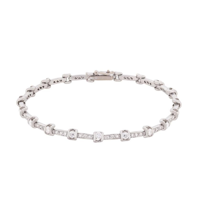 This vintage bracelet features a mix of round brilliant diamonds and eight-cut diamonds. There are nineteen round brilliant shining stones which have a combined weight of 1.90 carats. The eight-cuts which sit in between each set diamond have a total