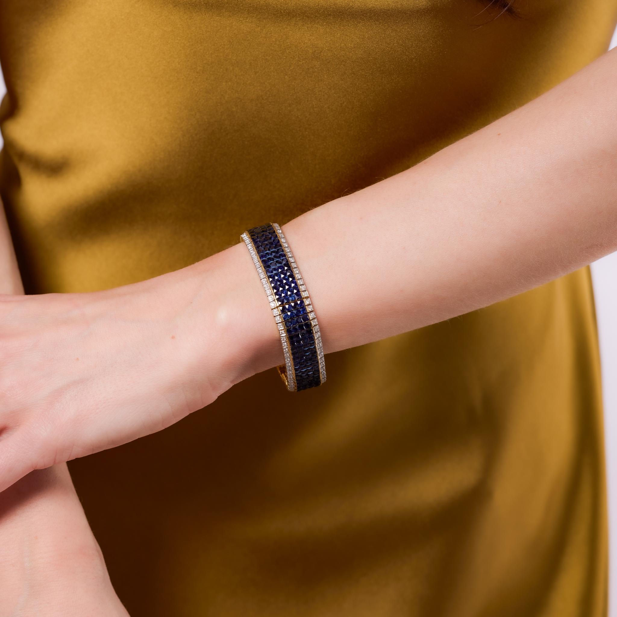 Crafted in the 1980s, this vintage bracelet is a stunning display of vibrant color and refined craftsmanship. It features 260 French cut sapphires totaling approximately 25 carats, set in rich 18k yellow gold. Accented by 130 round brilliant cut