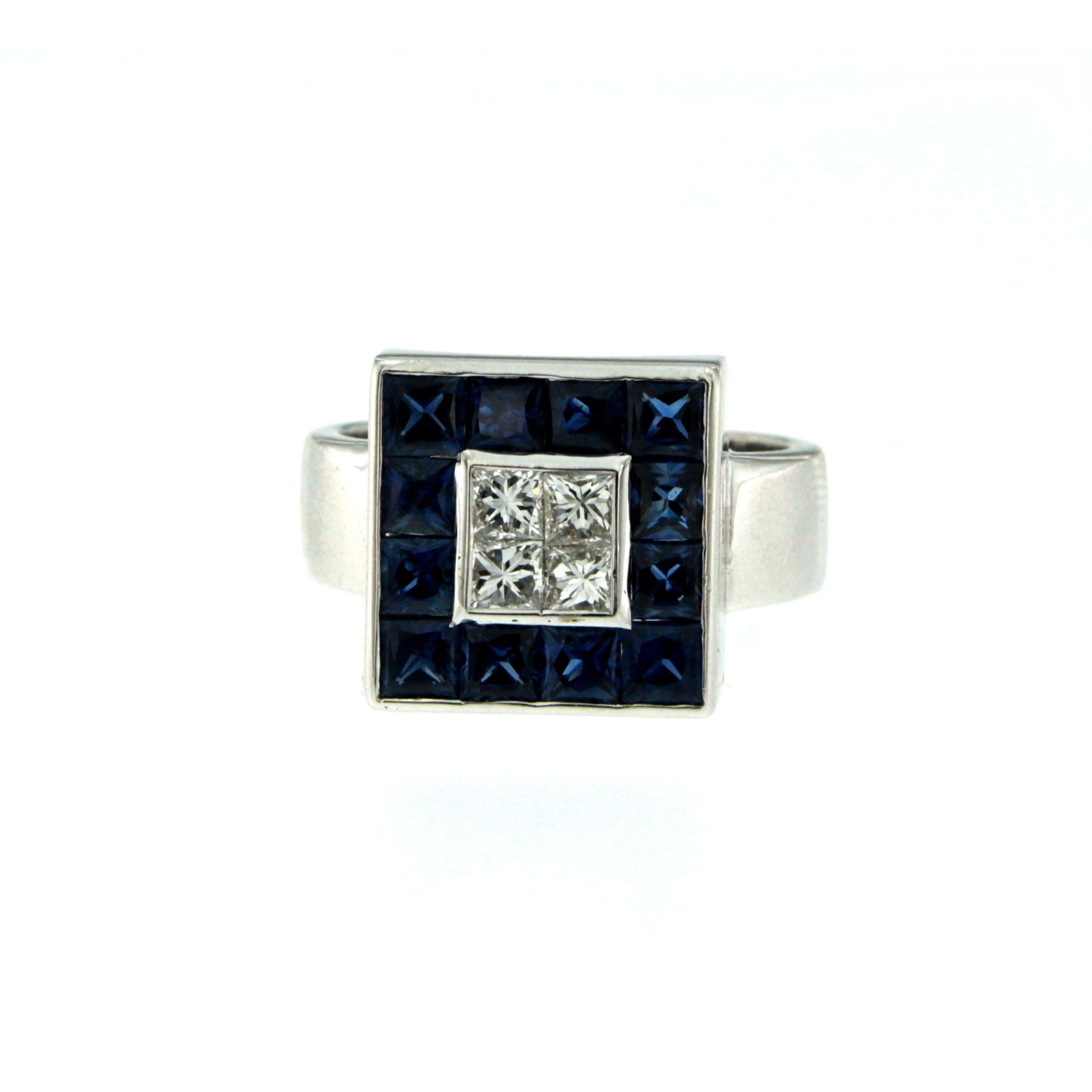 An elegant and unusual square design ring, hand made in 18k White Gold and set with 4 large Princess Cut Diamonds in the center, weighs 1 carat total and graded F/G color Vvs clarity, surrounded by 2.50 carats of Natural Blue Burma square cut