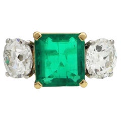 Vintage 2.50 Carat Emerald and Diamond Three Stone Ring in Platinum