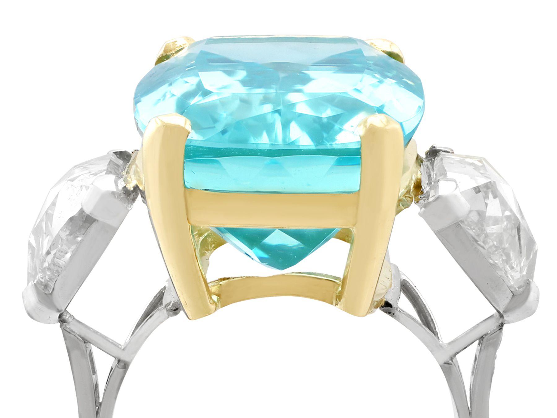 A stunning vintage 25.23 carat aquamarine and 3.40 carat diamond, 18 karat yellow gold and platinum dress ring; part of our diverse vintage jewelry and estate jewelry collections

This stunning, fine and impressive vintage aquamarine ring has been