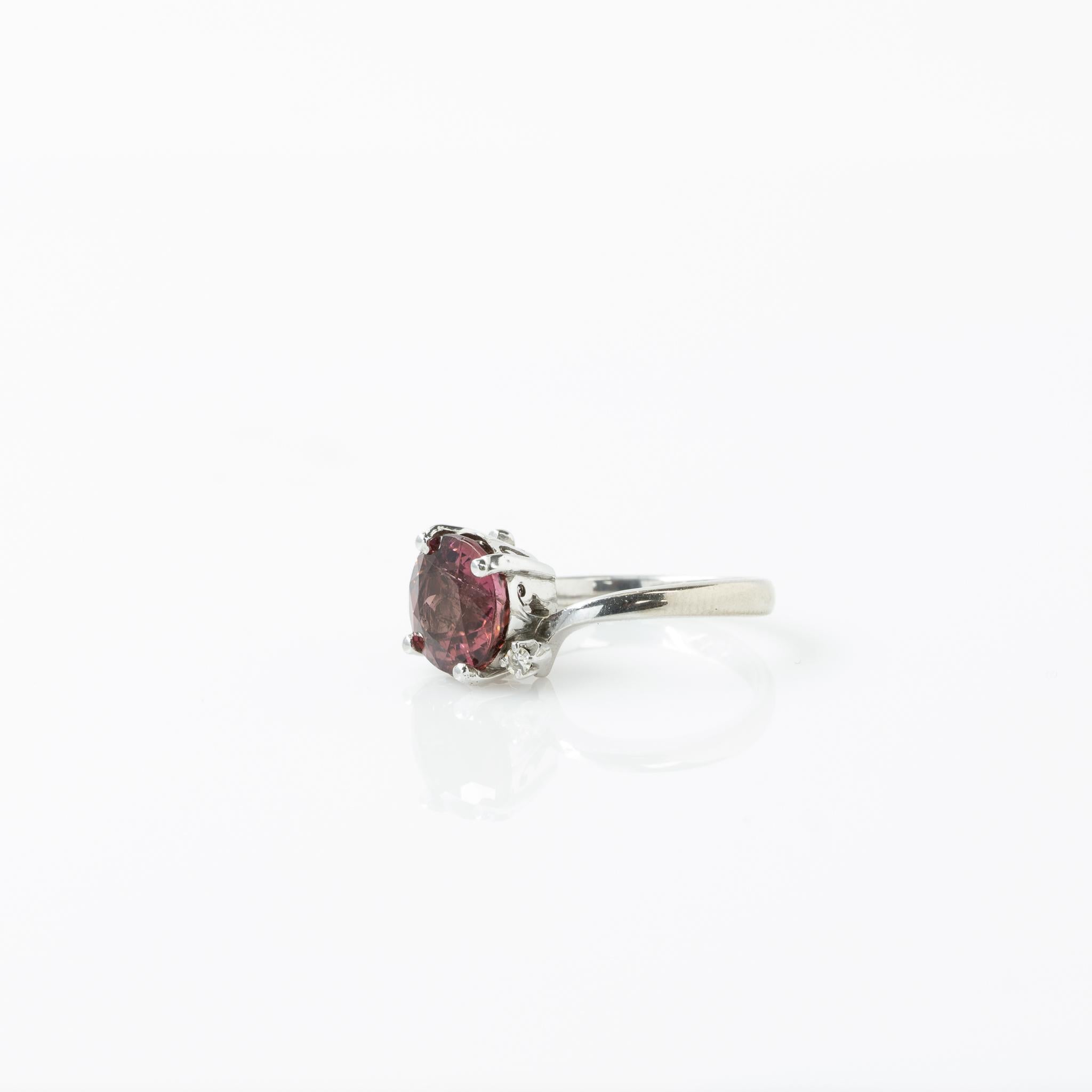 Size: 4.25
Metal Type: 14K White Gold (Tested)
Weight: 3.40G
Gold Melt Value: $159
Width: 8.85mm to 1.15mm at shank
Finger to Top of Ring: mm
Hallmarks: K 

Primary Gem Details: 
Type: Tourmaline
Quantity: 1
Cut: Round
Carat Weight: 2.59ct
Color: