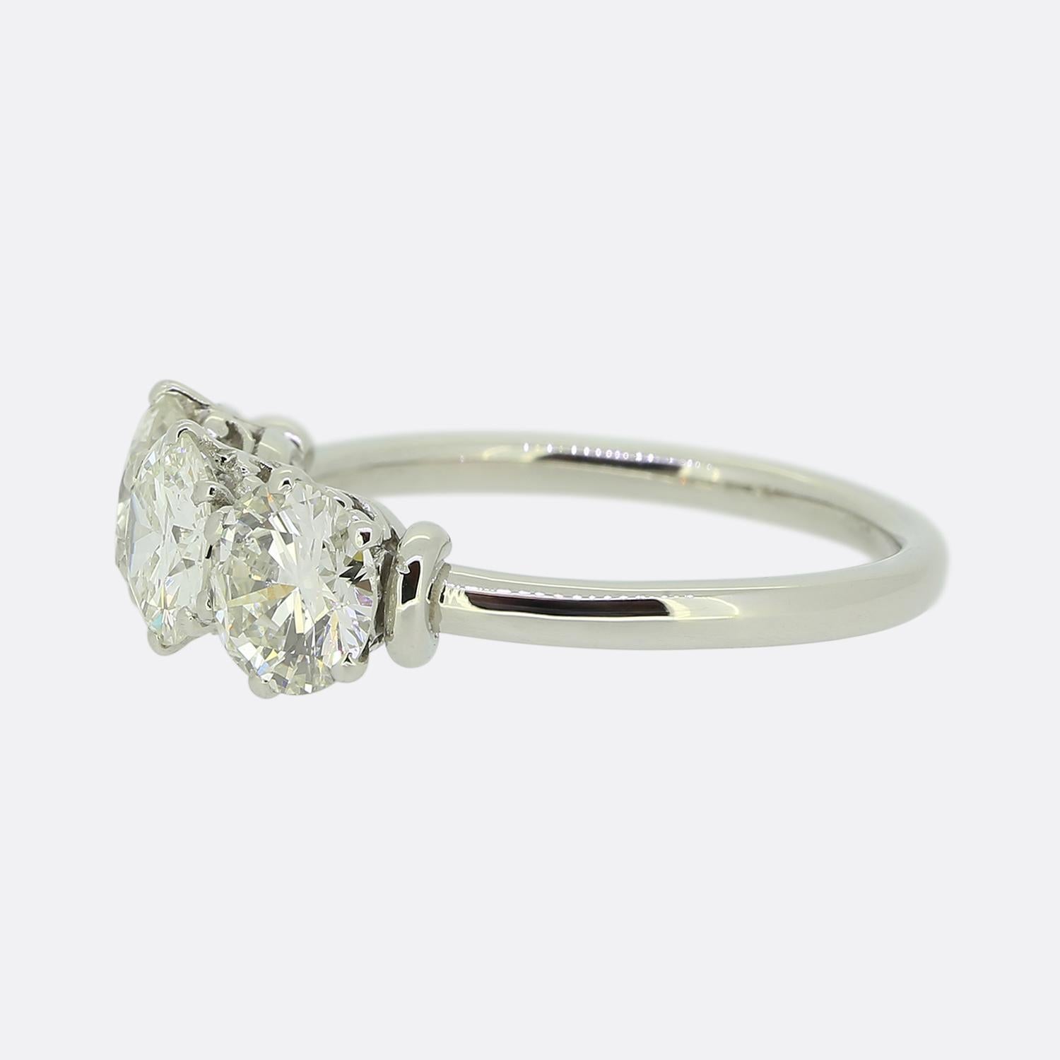 Here we have a wonderful three-stone diamond ring. This vintage piece has been crafted from platinum and features a trio of excellently matched round faceted transitional cut diamonds; all of which have been individually claw set in a collective
