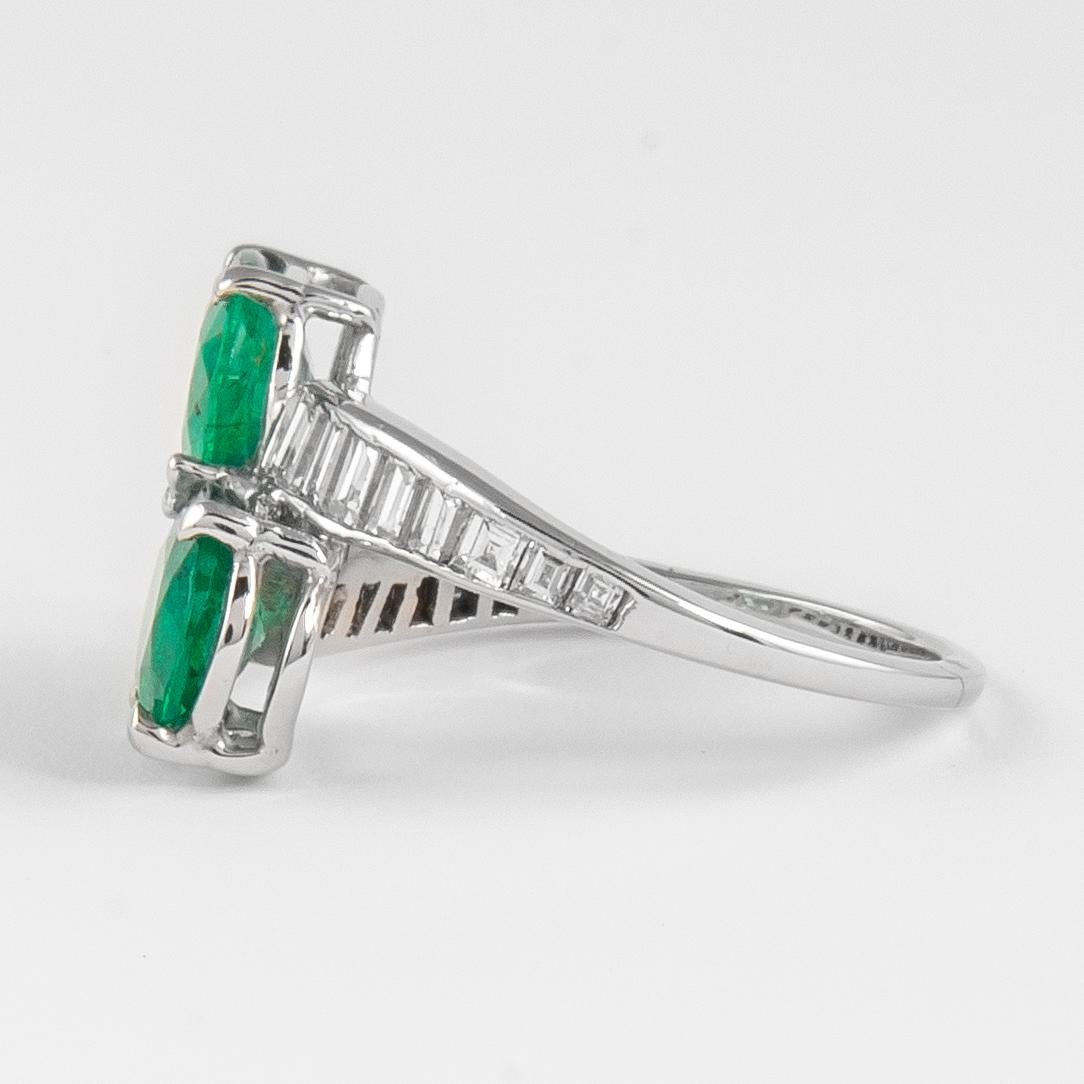 Oval Cut Vintage 2.62 Carat Emerald and Diamond Bypass Ring 18k White Gold For Sale