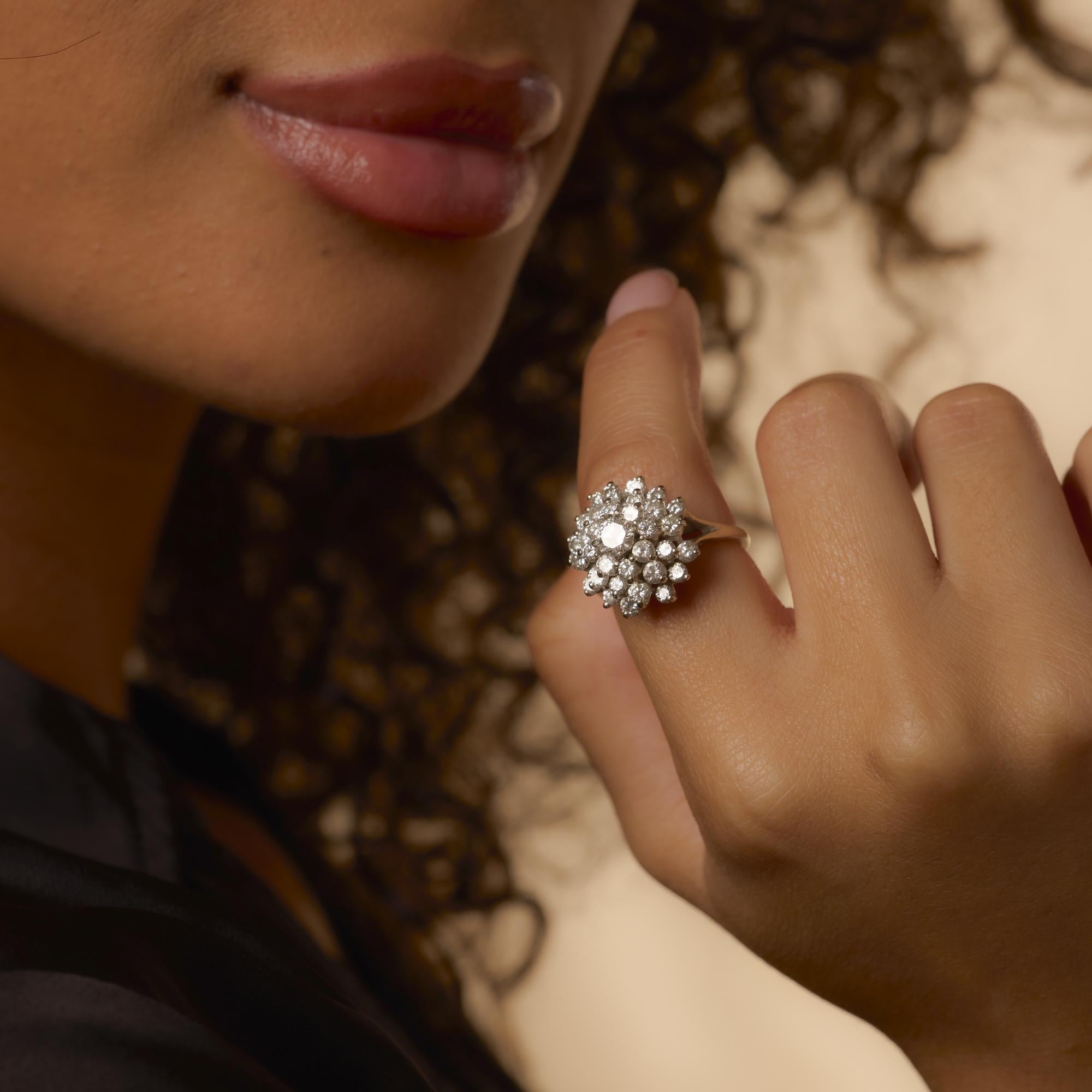 This vintage 1980s ring dazzles with 33 brilliant diamonds totaling 2.65 carats, all set in polished 14k white gold for striking, timeless sparkle.