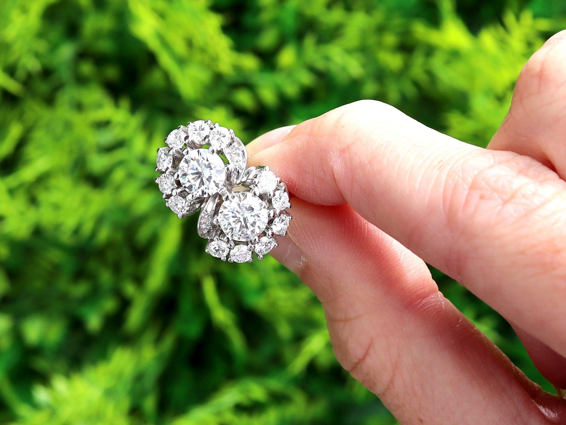 A stunning, fine and impressive vintage 1960's 2.75 carat diamond and 14 karat white gold twist style dress ring; part of our diverse collection of diamond cluster rings.

This stunning, fine and impressive vintage cluster ring has been crafted in