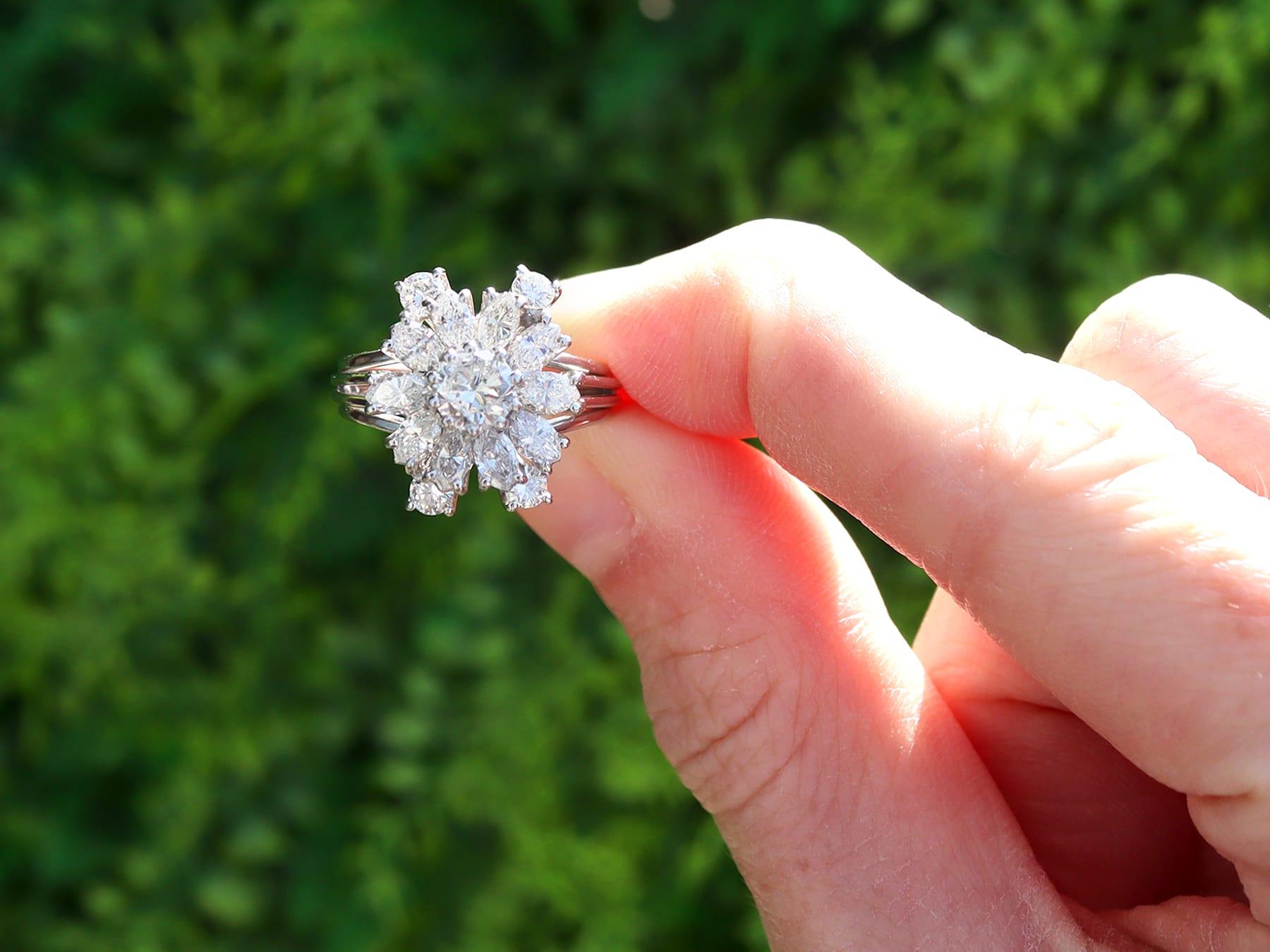 A stunning, fine and impressive vintage 1950s 2.76 carat diamond and platinum cluster engagement ring; part of our diamond jewelry/estate jewelry collections.

This stunning, fine and impressive vintage engagement ring has been crafted in