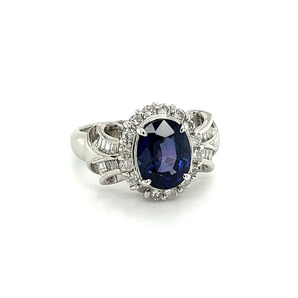 Simply Beautiful! Finely detailed Sapphire and Diamond Platinum Ring. Centering a securely nestled Hand set 2.81 Carat Violetish Blue Sapphire GIA. Surrounded by 0.60tcw Baguette and RBC Diamonds. GIA certificate # 5231064115. Ring size 6.25, we
