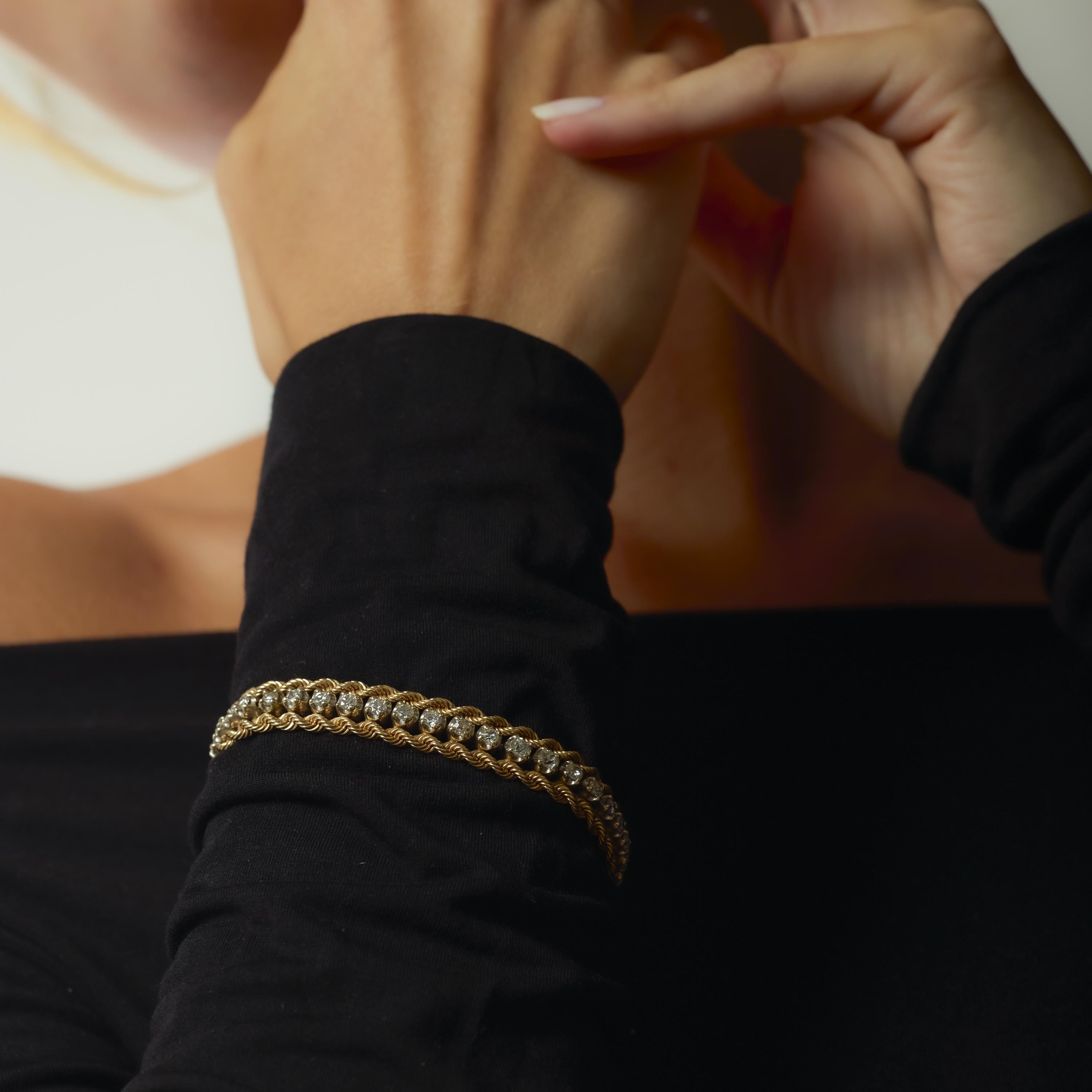 This vintage 14k yellow gold bracelet sparkles with forty round brilliant cut diamonds totaling 2.85 carats. Crafted in the 1970s, its bold design and radiant sparkle make it a timeless piece of retro elegance and everyday luxury.