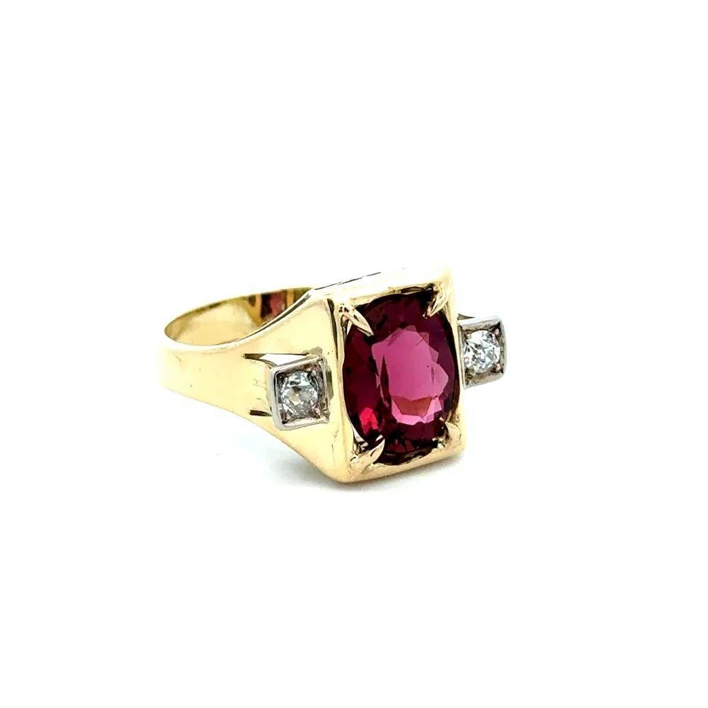 Simply Beautiful! Finely detailed Retro Cocktail Ring centering a securely nestled Hand set 2.90 Carat Purple Pink Rubelite Tourmaline. Enhanced with Diamonds, weighing approx. 0.20tcw on either side. Hand crafted Gold mounting. In excellent