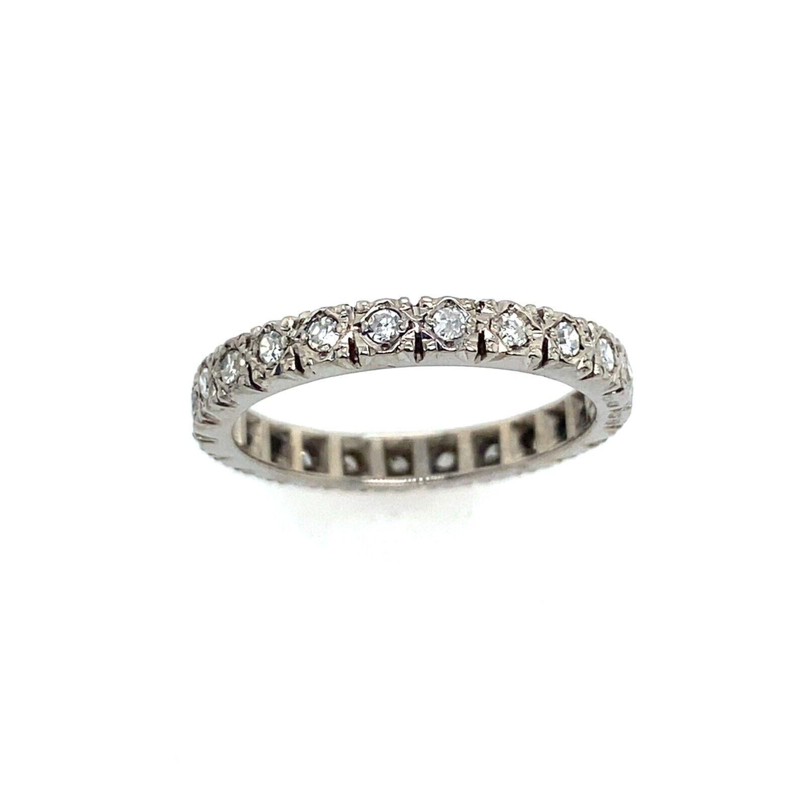 This beautiful 18ct White Gold eternity/wedding band is set with 0.65ct of Diamonds. The band has a total of 26 Diamonds set in delicate vintage setting. It is a perfect choice for stacking with other rings or wearing on its own.

Additional