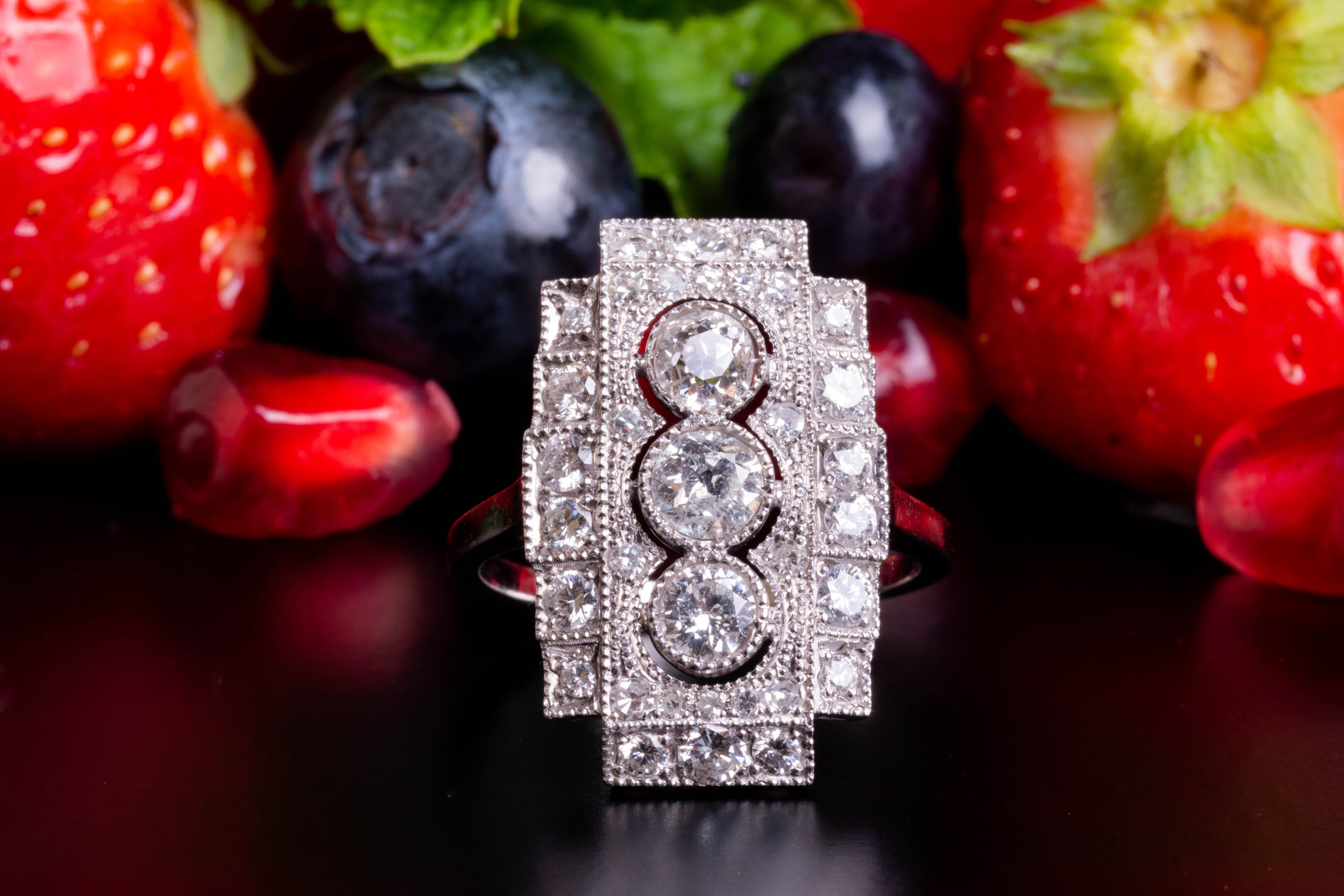 A HEAD-TURNING and 100% classy rectangle Art Deco tank diamond ring!

This unique and very substantial ring comes from Germany and is made of solid 18 ct white gold, dating back to the 1940 - 50`s. 

This stunning ring is very large and heavy