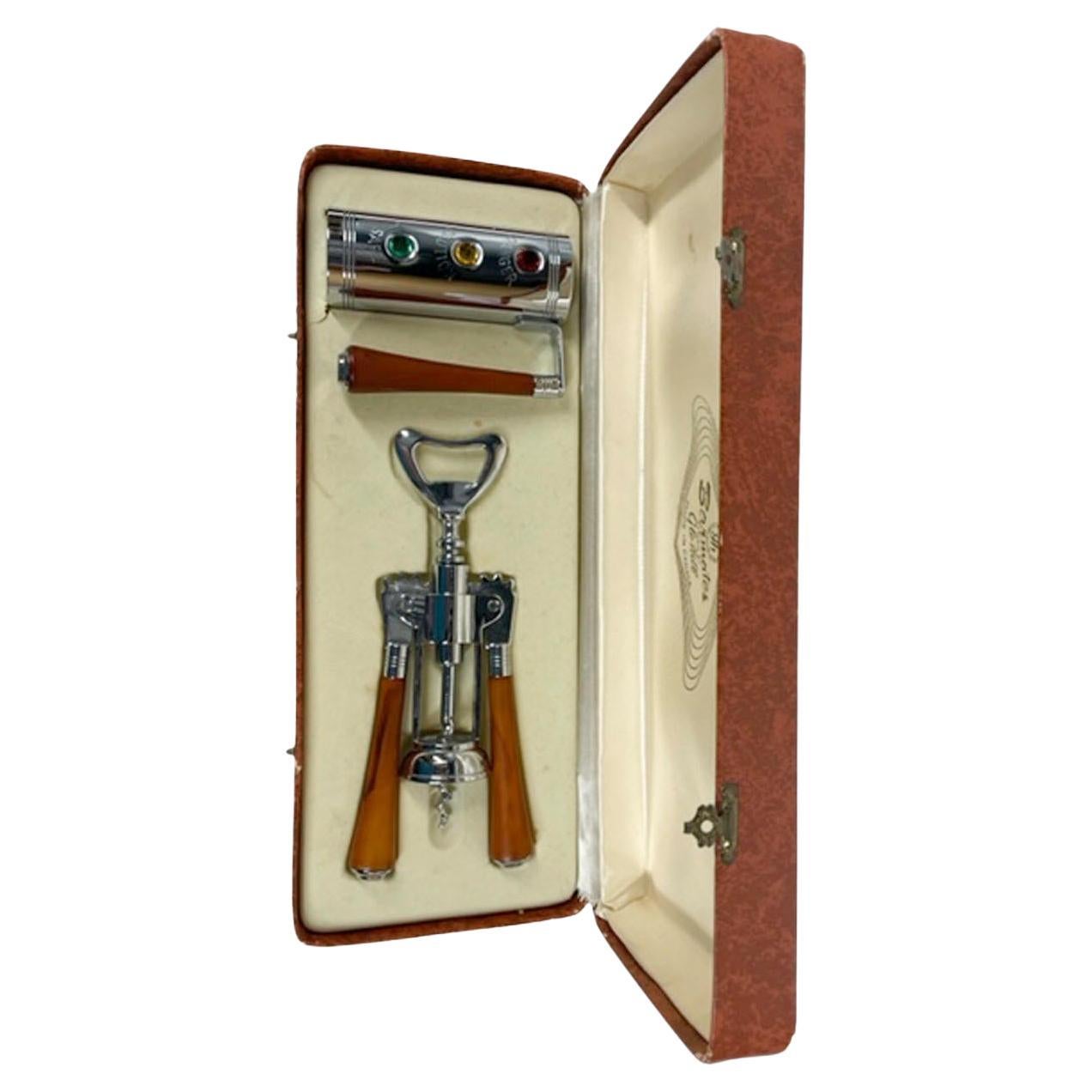 Vintage boxed 2-piece bar tool set, from Glo-Hills Barmates line. The set includes a jack-form chrome corkscrew with butterscotch Bakelite handles and a bottle opener top along with a handled jigger of cylindrical form and designed as a traffic