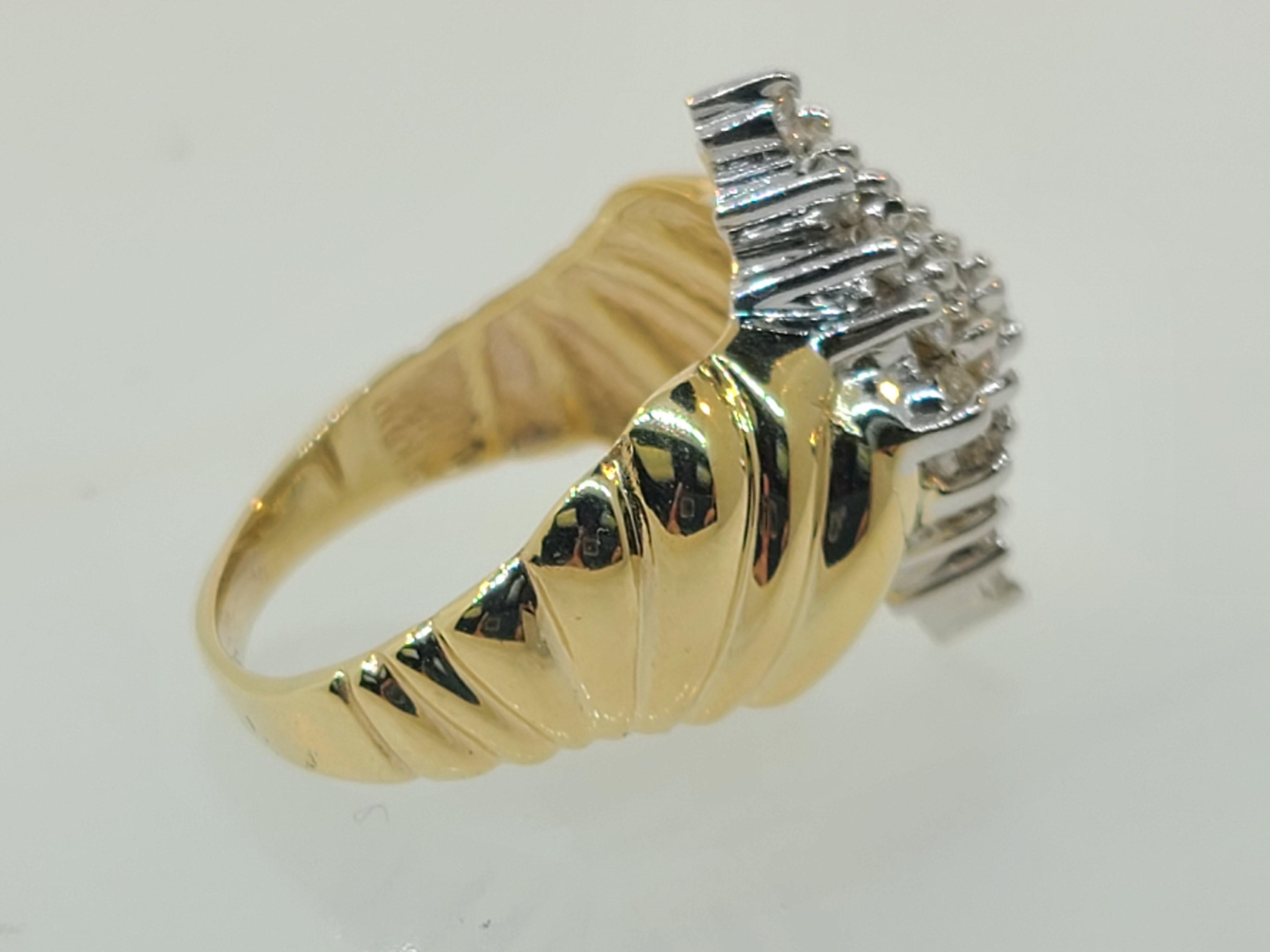 This wonderful two-toned vintage cocktail ring has 25 small diamonds in a marquise pattern comprise the head of this wonderful ring. The white luster of the rhodium plated head accents the diamonds perfectly and is complimented by the yellow gold