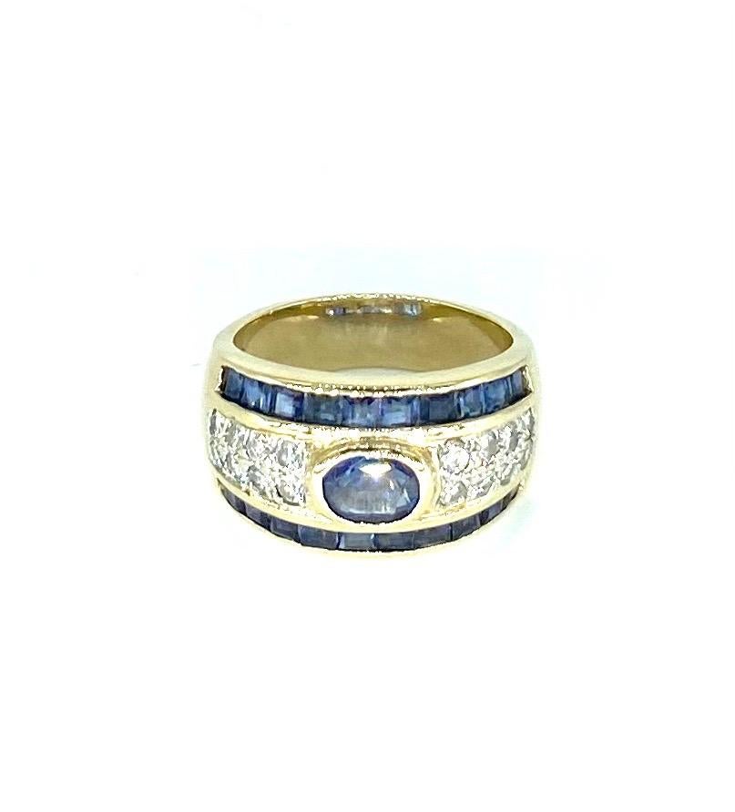 Vintage 3 Carat Blue Sapphire & Diamonds Band Ring 14k Gold. The ring features a natural transparent center blue sapphire weighting approx 0.60 carat and surrounding blue sapphires square cut approx weighing 2 carats. The Diamonds featured are white