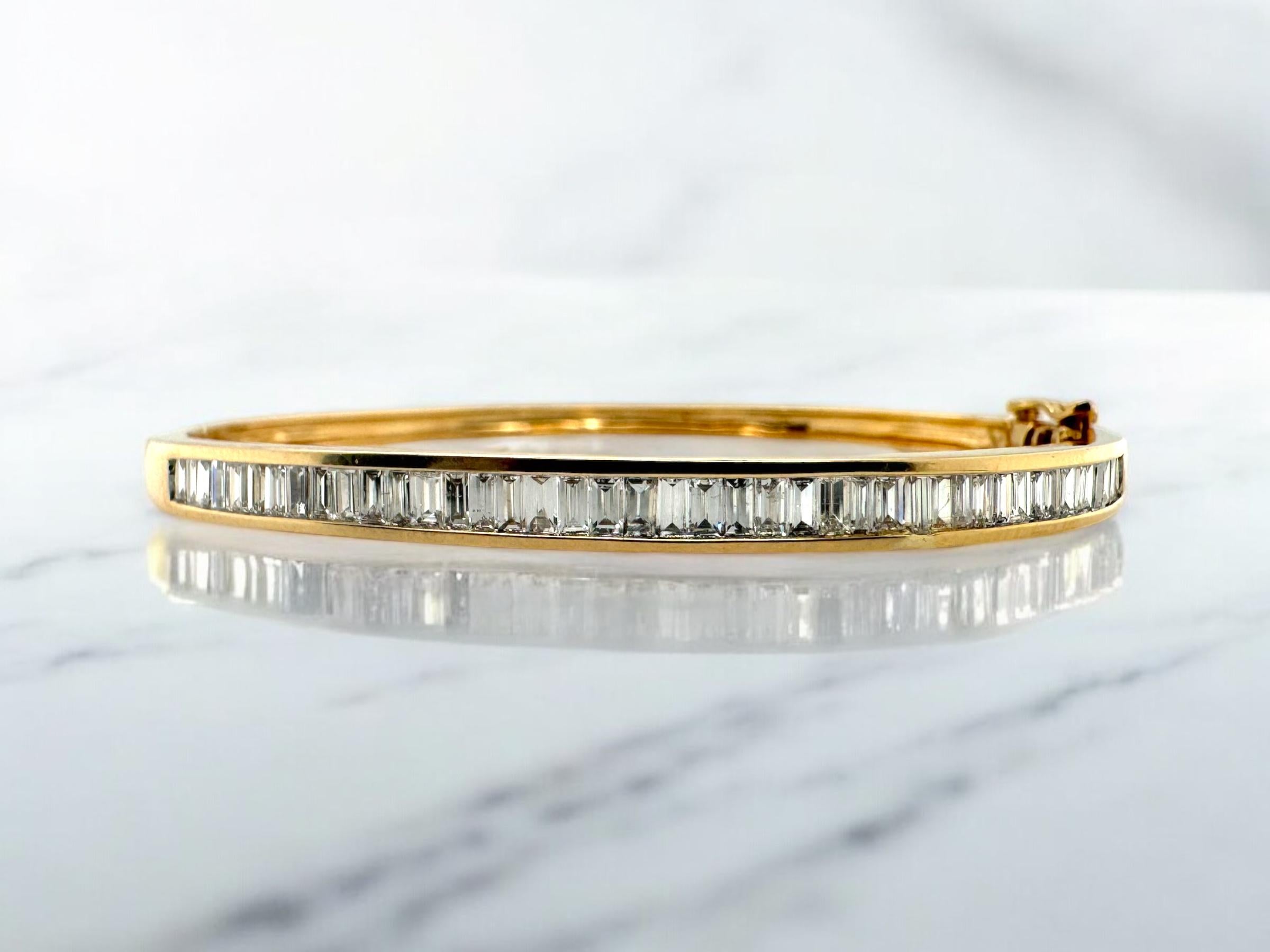 We are loving this charming beauty!

Bracelet Details
Material: 14K Yellow Gold
Head Width: 4.4mm
Weight: 13.4 Grams
Wrist Size: 7 Inches

Accented by the following gemstones
43 - 3mm X 1.75mm Baguette Cut Diamonds; GH Color; VS Clarity; Estimated