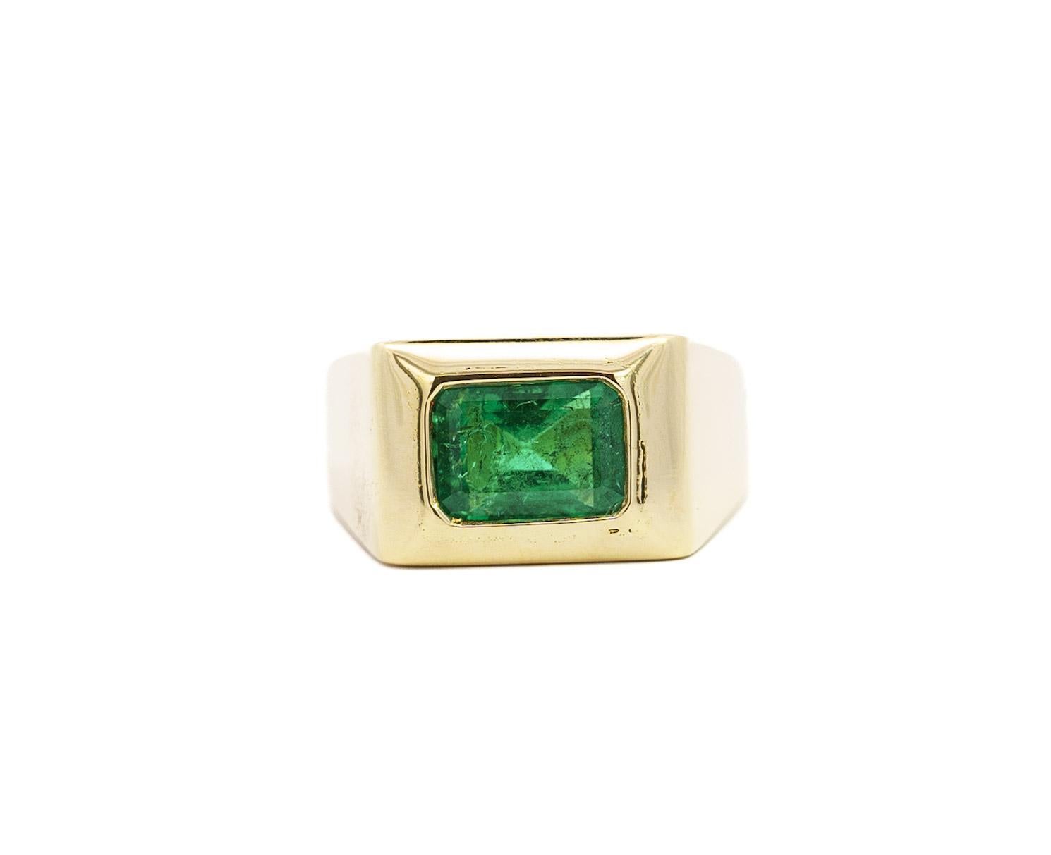 Vintage 18K Yellow Gold Solitaire Men's Ring, weighing 15.4 grams, the ring showcases a ~3.0 carat Emerald-Cut Emerald (10.65 x 7.6 x 6.1mm) in a bezel setting. A simple and classy ring that is noticeably valuable. 

The emerald features a darker