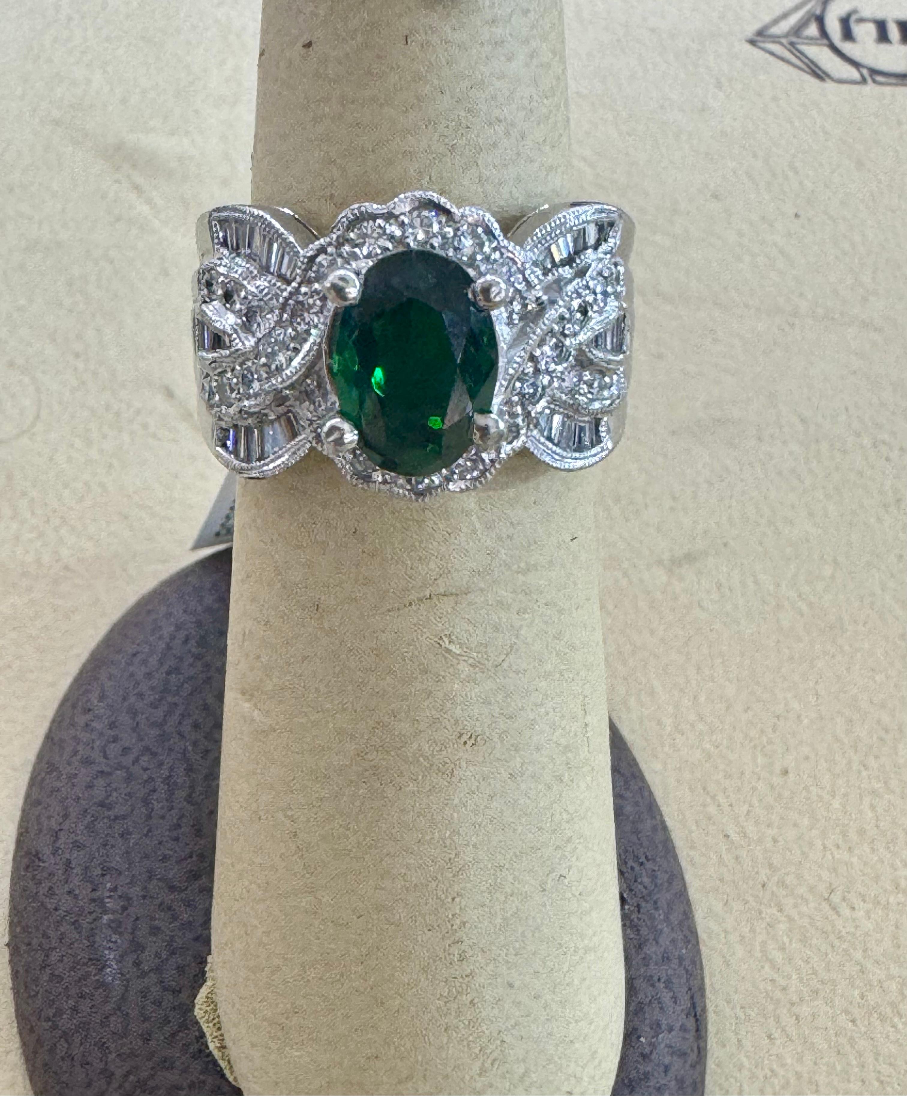 Vintage Approximately 3 Carat Oval Tsavorite & 2.2 Carat Diamond Ring , Platinum 16.4Gm Estate
 Size 6
Tsavorite of this size are very precious!
Approximately 3Carat   Oval cut Tsavorite and Diamond Ring, Estate with no color enhancement.
Platinum