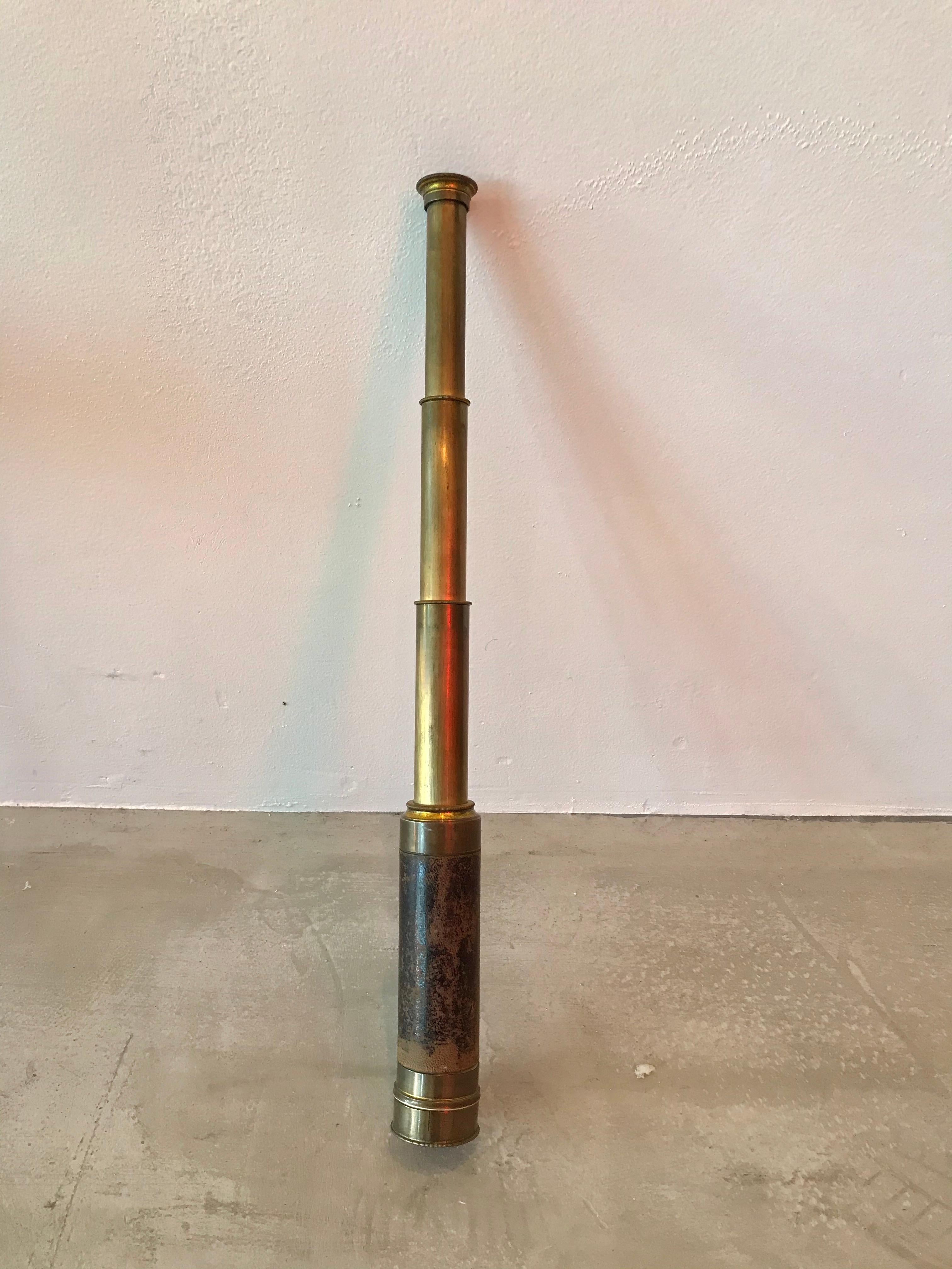 Vintage brown leather and brass 3 draw extendable hand telescope. Comes with original cap to cover glass end and brass eyepiece cover that slides in and out of place. Original leather carrying case included. Imprinted that it was made in France and