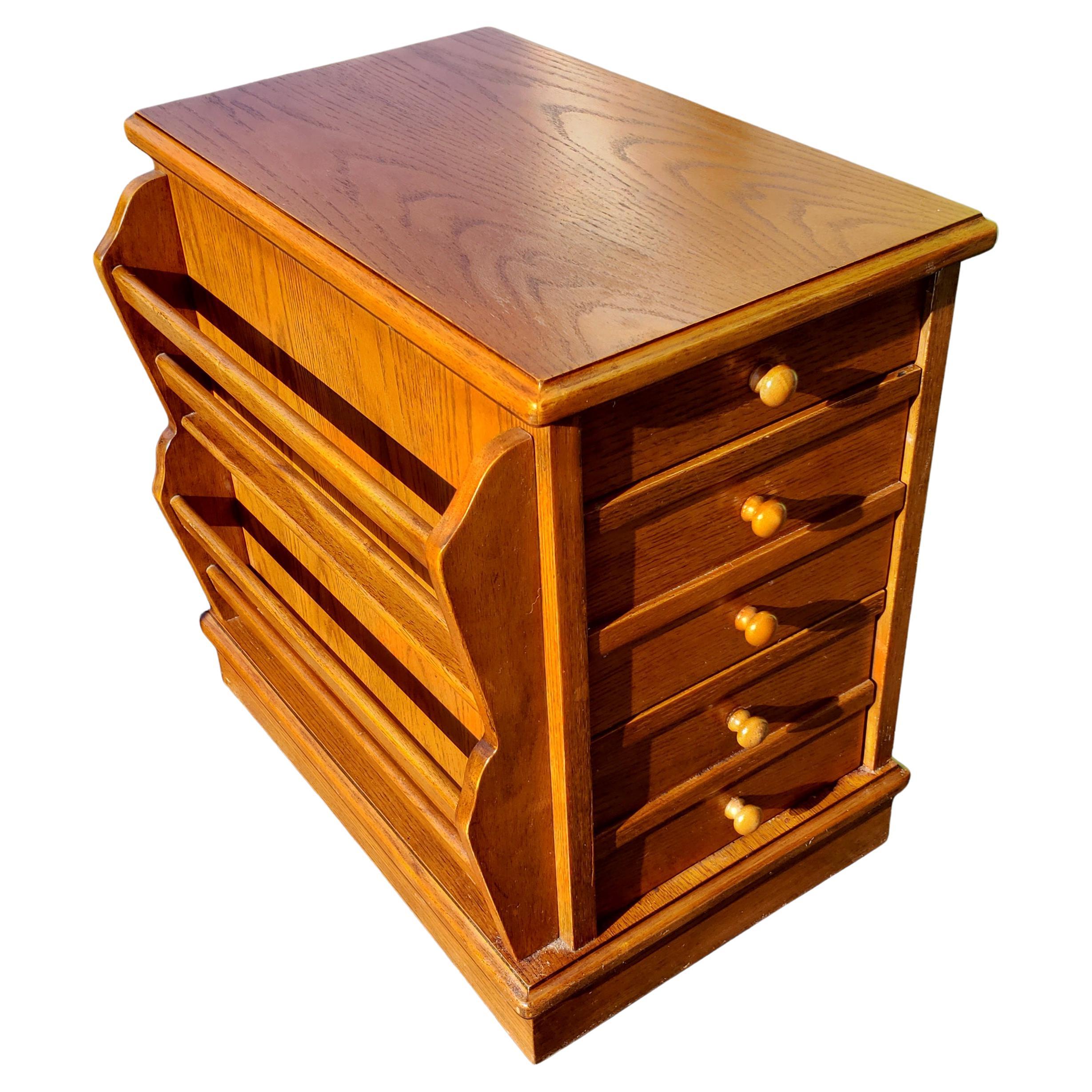 Rare set of solid oak side tables magazines racks from the 1970s. Amish crafted in Pennsylvania. 
Feature 3 drawers. Top drawer consists of a hot proof drink coaster and desert plate coaster and two bottom deep drawers. Dovetail drawers and wood