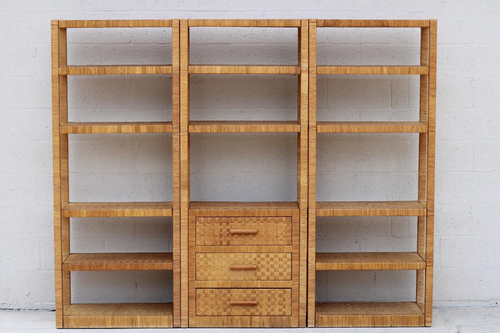 Vintage Billy Baldwin Style 3-Piece Wrapped Cane Etagere Wall Unit

Fabulous vintage 3-piece rattan wall unit features beautiful basketweave detail on drawer fronts and shelves. Expertly crafted with hand-wrapped rattan over hardwood construction.