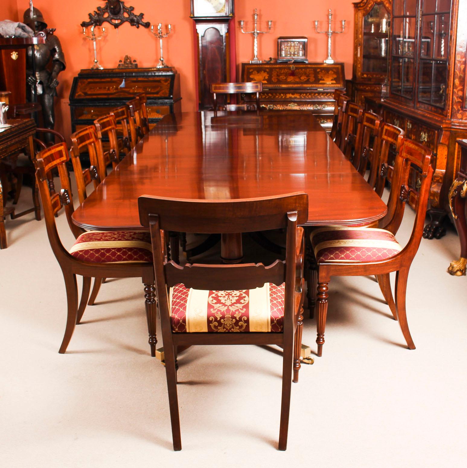 This is fabulous Vintage dining set comprising a Regency style dining table by William Tillman, Circa 1980 in date and a matching set of twelve dining chairs.

The table is made of stunning solid flame mahogany and is raised on three 