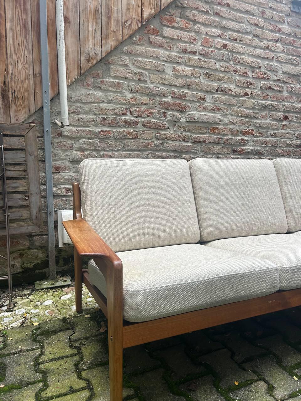 Vintage 3-Seater Sofa by Arne Wahl Iversen, Made in Denmark. Solid teakwood frame and cream colored upholstery covers ind good condition.