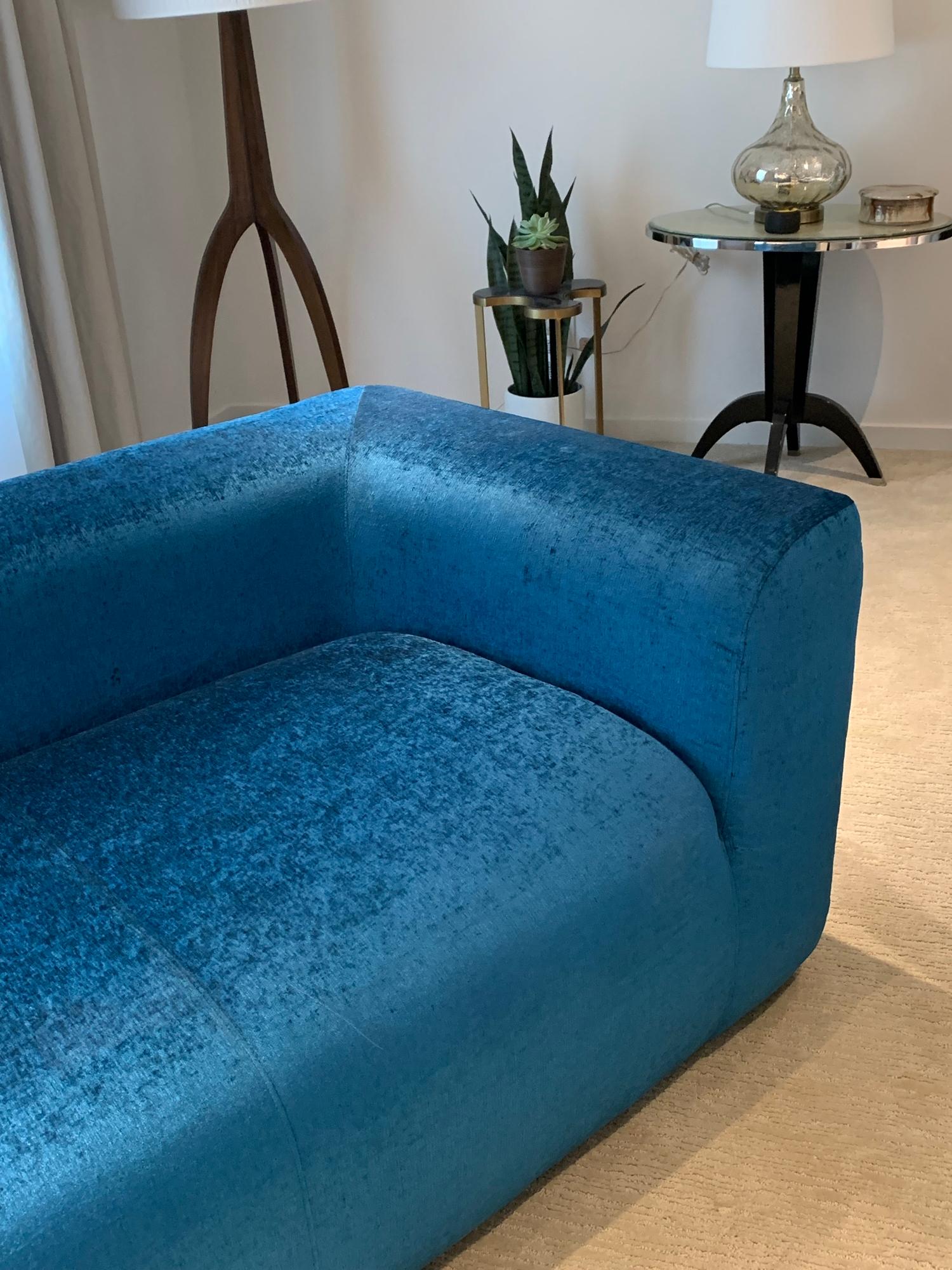 Beautiful 3-seat vintage sofa designed and manufactured in 1975 by August Inc. and part of the August series.
The sofa was recently upholstered in a blue Romo fabric and is in excellent condition and ready to ship.
Measurements:
84” wide x 32”