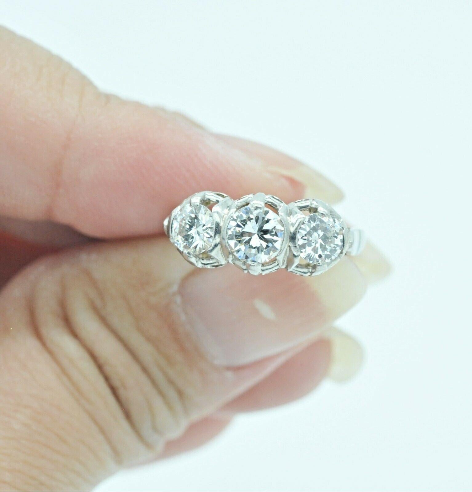 Total Carat Weight:1.02
Diamond Clarity Grade:Slightly Included (SI2)
Setting Style:Three-Stone
Type:Engagement Ring
Metal Purity:14k
Main Stone:Diamond
Metal:White Gold
Brand:Antique
Diamond Color Grade:G
Ring Size:5
Main Stone Shape:Round