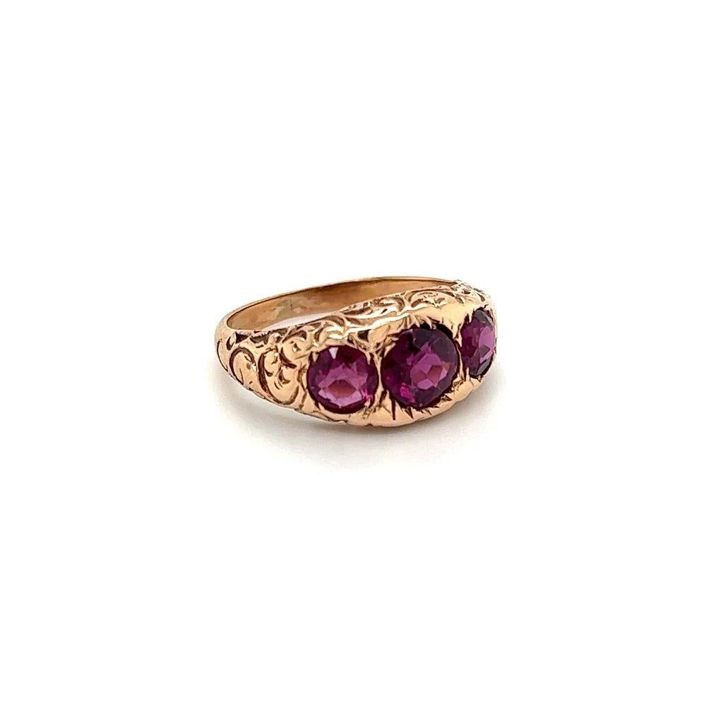 Vintage 3 Stone Grape Garnet Antique Engraved Gold Ring Simply Beautiful! Finely detailed Antique Three Stone Grape Garnet Engraved Gold Ring. Centering securely nestled 3 Garnets, weighing approx. 2.00tcw. Ring size: 5.5, we offer ring re-sizing.