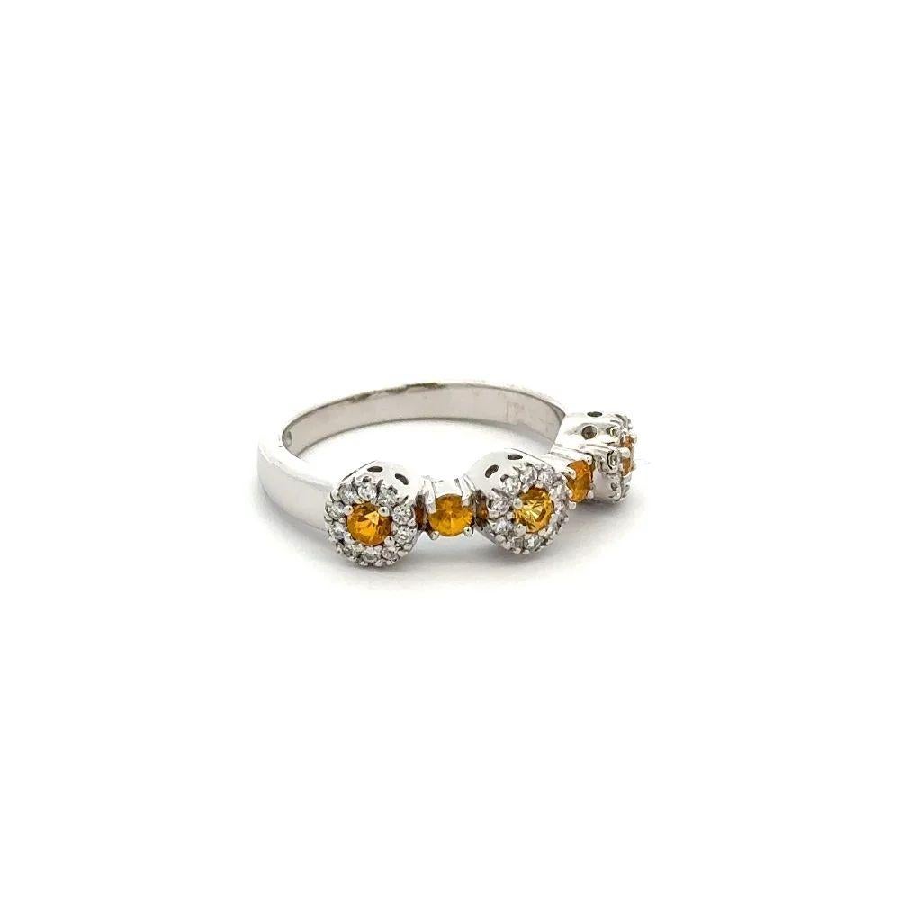 Simply Beautiful! Finely detailed Gold Three-Stone Yellow Sapphire and Diamond Trilogy Ring. Securely Hand set with Round Yellow Sapphires, weighing approx.  0.35 Carat and Round Brilliant Cut Diamonds, approx. 0.15tcw. Hand crafted 14K White Gold
