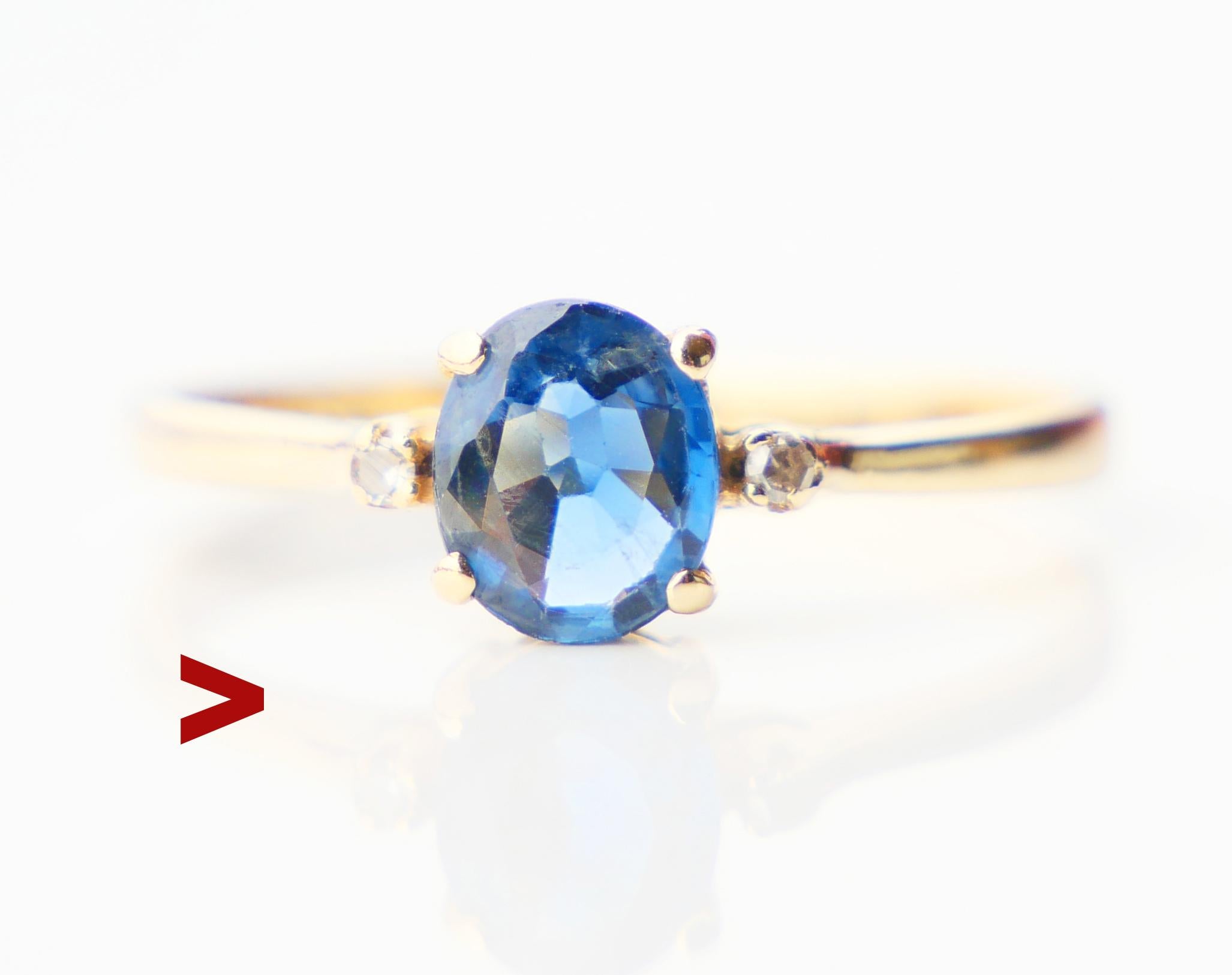 Vintage Danish Sapphire and Diamonds Ring. The band is solid 14ct Yellow Gold with claw set natural medium Blue / transparent Sapphire oval cut 6mm x 5 mm x 2.35 mm deep / 0.75 ct + 2 Diamonds Ø 1.5 mm /0.015 ct each. Hallmarked with the initials of