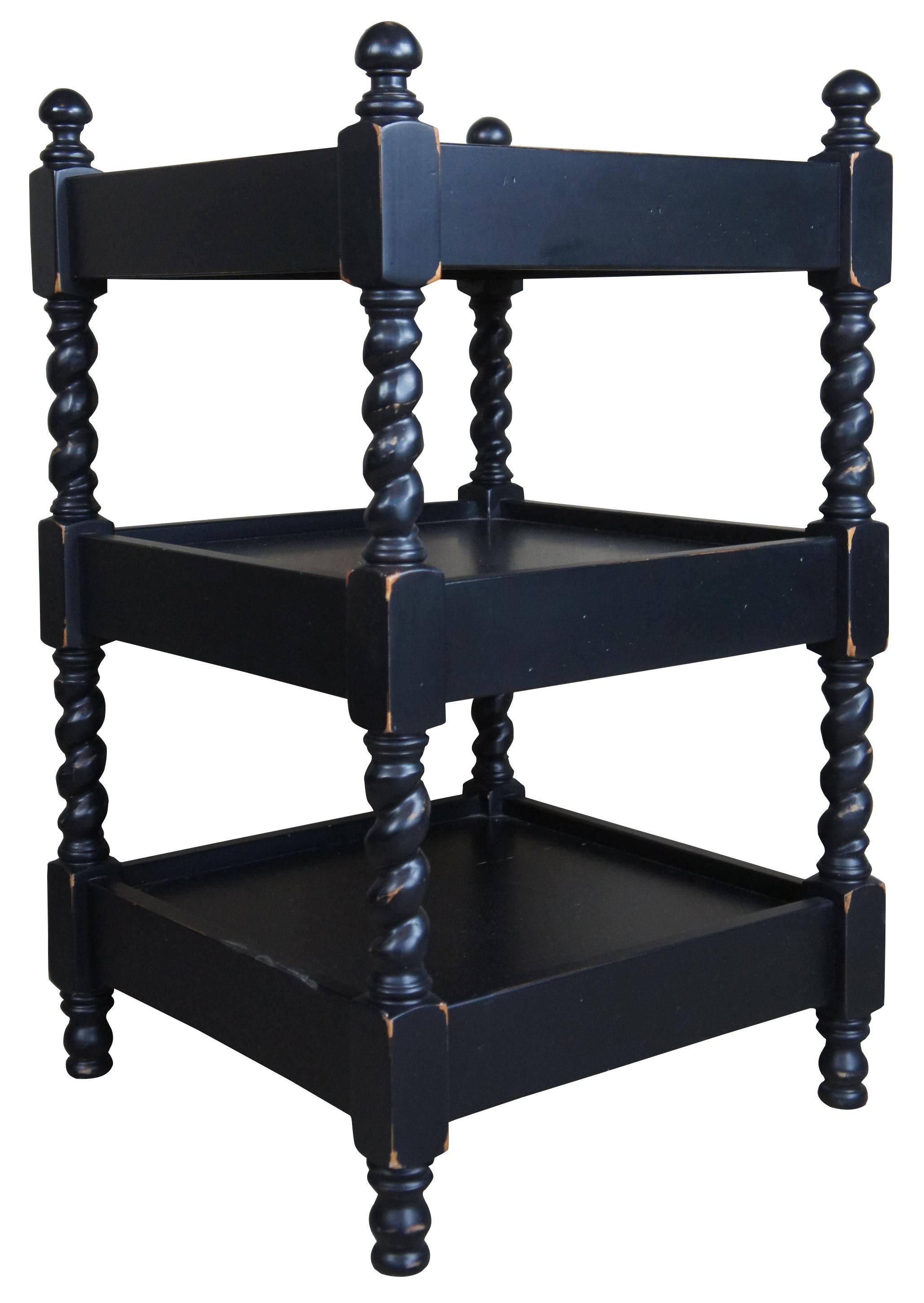 A quaint set of barley twist end tables. Features a 3 tier design with inset tops and a distressed finish. Drawing inspiration from Louis XIII and English styling. Measure: 30