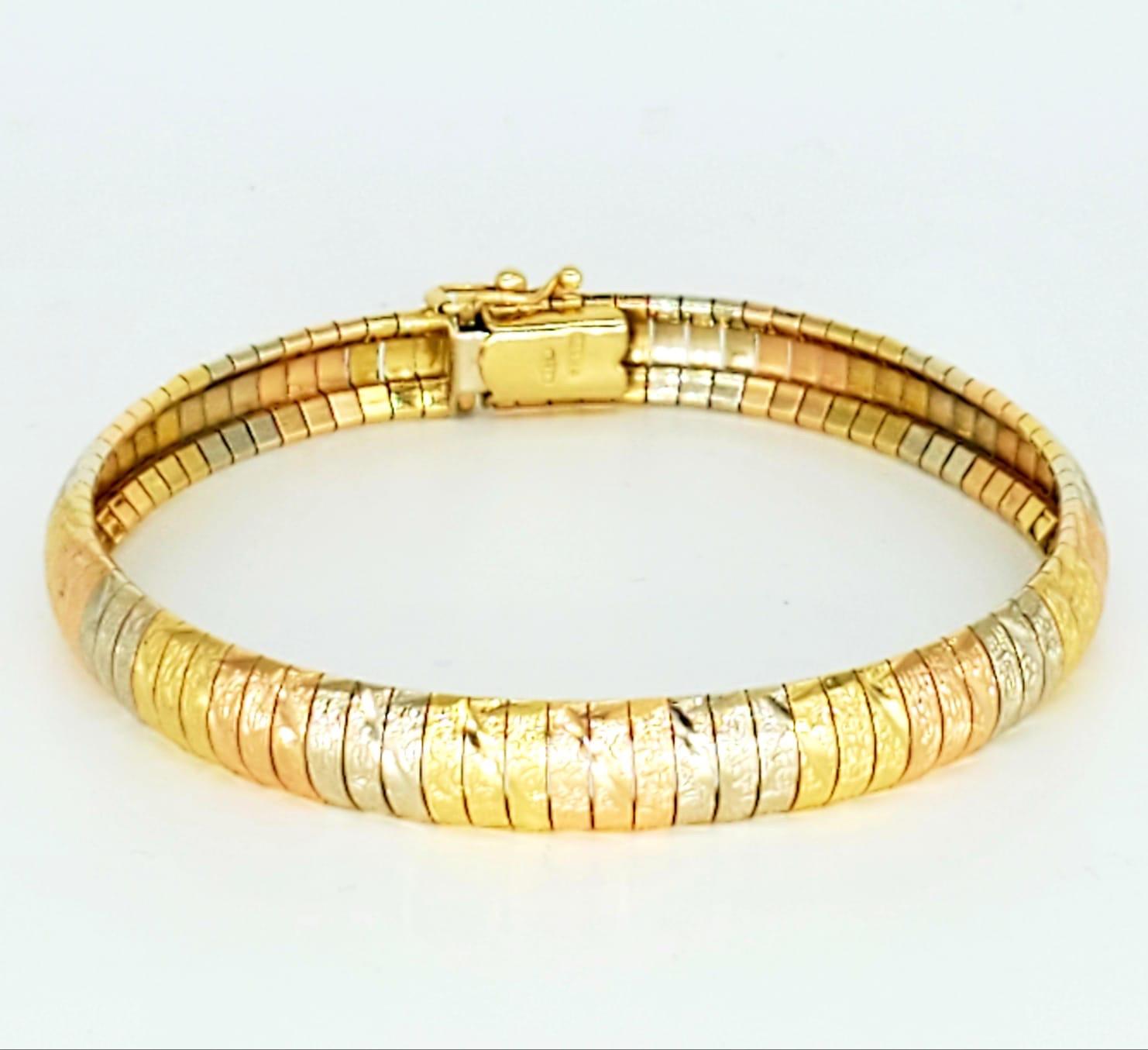 Vintage 3-Tone Woven Snake Design 18k Bracelet. The bracelet is 7.6mm wide and 7.5 inches long. The bracelet features a beautiful design with Diamond dust frost making it look glittery sparkly while it’s just the enhancements of the design. The