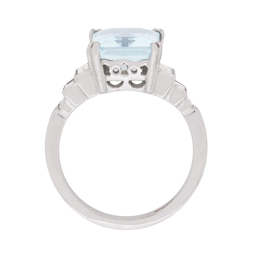 You might look at this bold 3.00 carat aquamarine dress ring with its stepped, diamond set shoulders and think 'Art Deco', but it actually dates from the 1970s. At the centre of this vintage ring, four double claws secure a beautiful and substantial