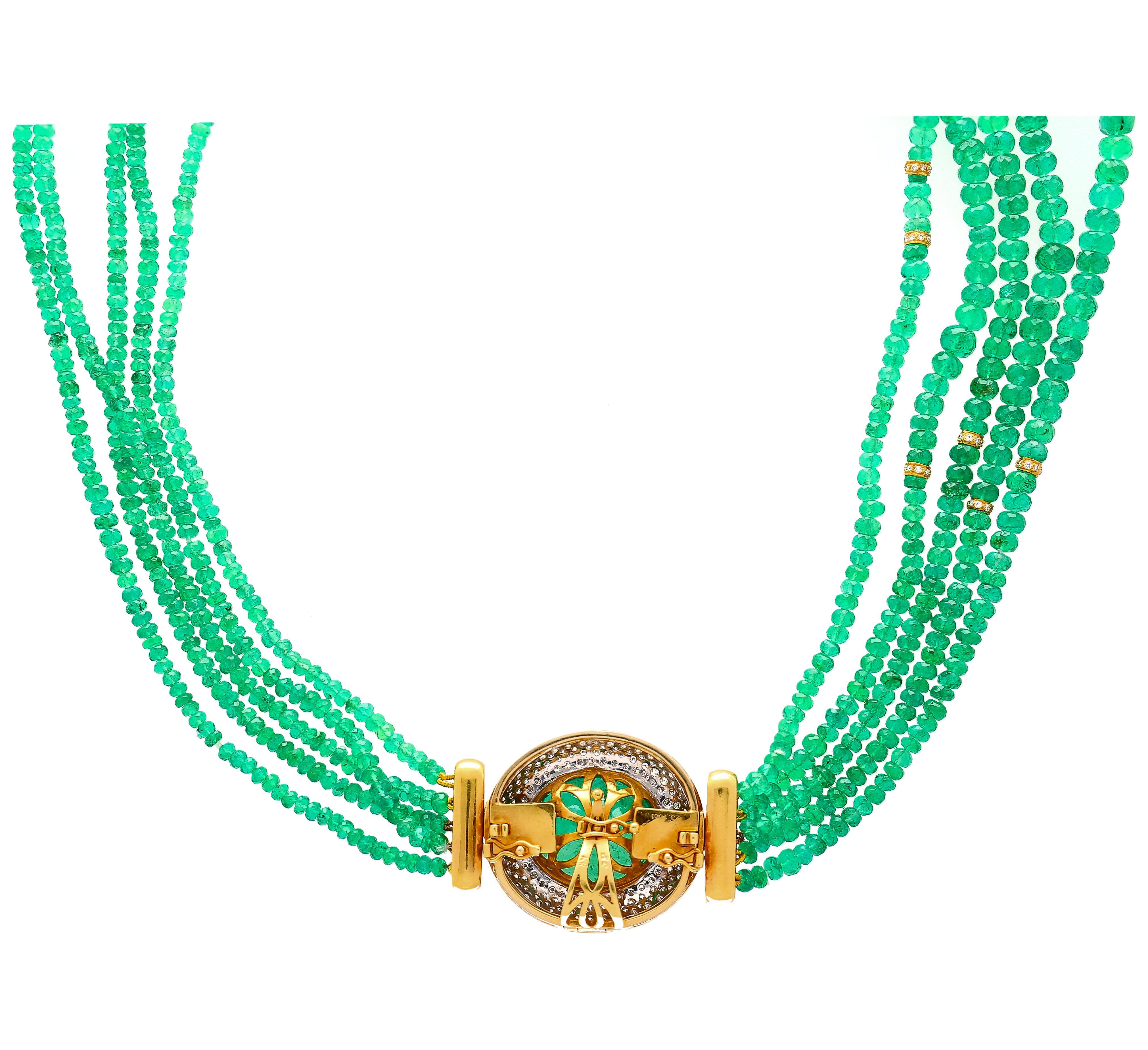Vintage retro-style oval cut emerald and diamond bead necklace. Set in 18k yellow gold. The necklace features 234 oval cut diamonds, and 3.5mm (approx.) emerald beads that form 22 inches of luxury necklace. The emerald center stone features a