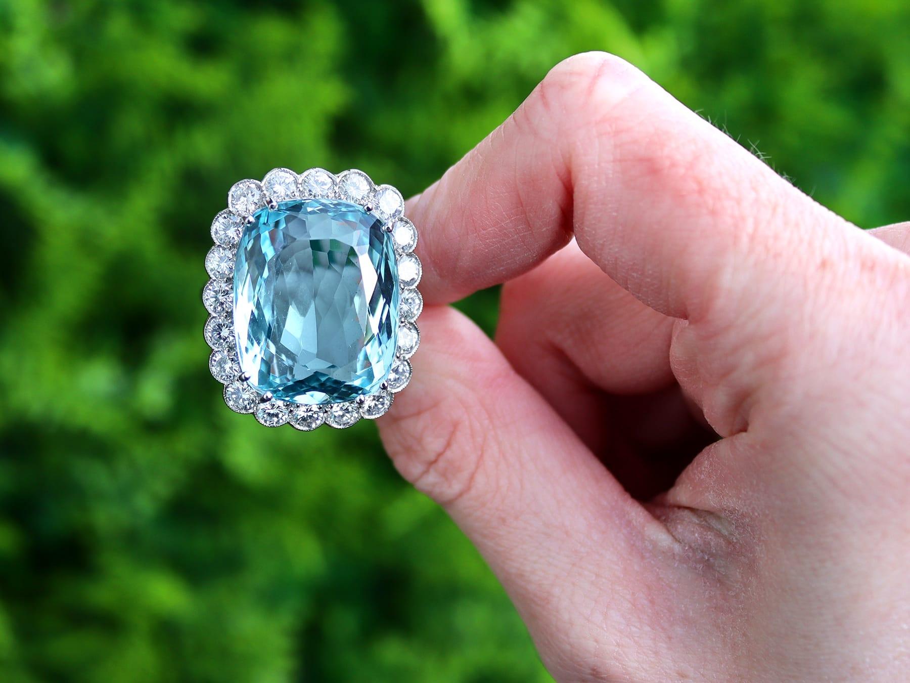 A stunning, fine and impressive 30.09 carat aquamarine and 2.94 carat diamond, 18 karat yellow gold and 18 karat white gold set dress ring; part of our diverse aquamarine jewelry and estate jewelry collections.

This stunning, fine and impressive