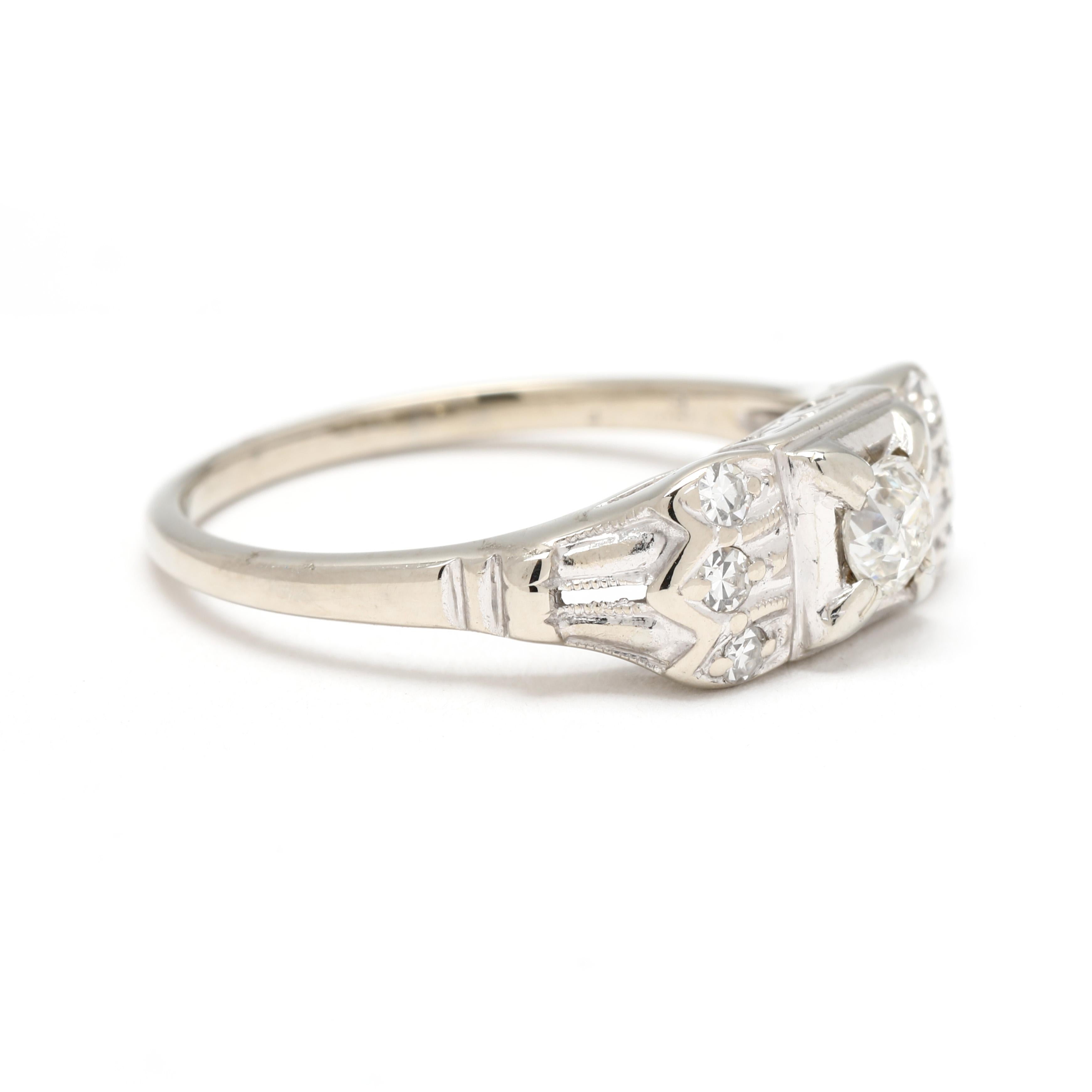 Stones:
diamonds
old European cut, 1 stone
3.75 mm
approximately .21 carat
G-H color, I1 clarity (*cavity)
single cut, 6 stones
1.6 - 1.75 mm
approximately .09 total carats
G-H color, VS clarity

Ring Size 6

Width: 6 mm

Weight: 1.6 dwts. / 2.5