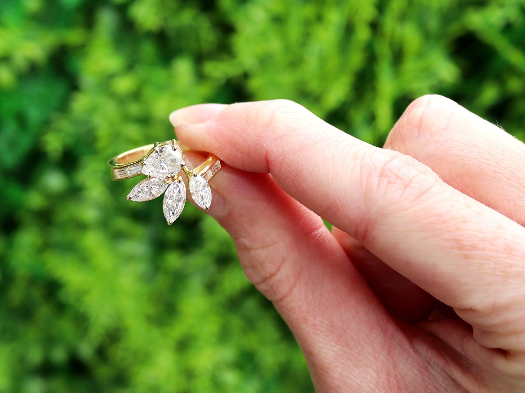 A stunning, fine and impressive vintage 3.13 carat pear and marquise cut diamond and 18 karat yellow gold dress ring; part of our diverse collections of diamond dress rings.

This stunning, fine and impressive vintage diamond dress ring has been