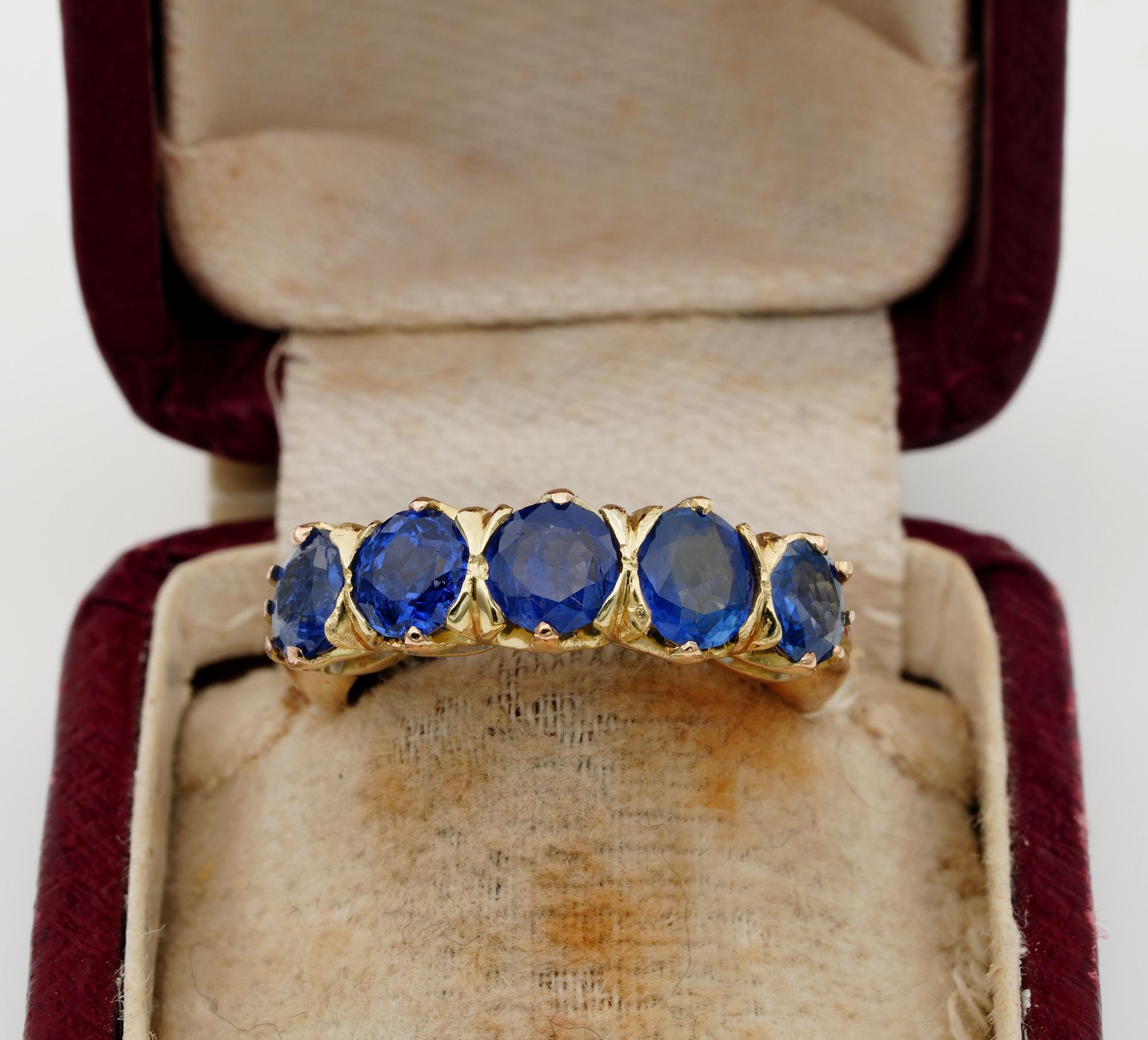 Superb 1930 ca five stone natural Sapphire ring
Hand crafted mounting beautifully rendered of solid 18 Kt gold
designed with a raised fret work lifting up the stone’s array for more effect
Set with an array of five round faceted cut Natural
