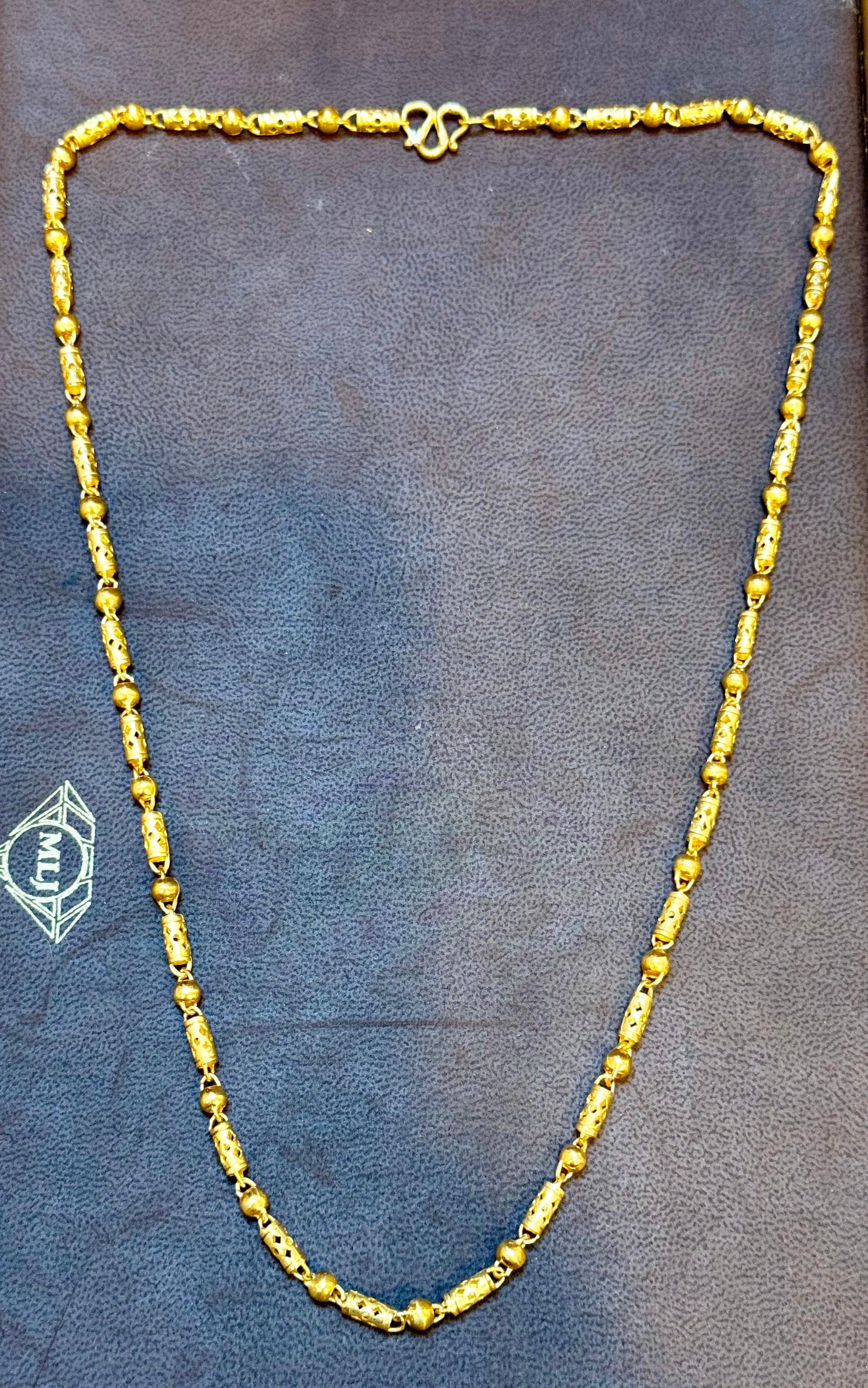 Vintage 31.5Gm Pure 24 Karat Yellow Gold Handmade  Chain 22 inch long
 pure gold

4.25 MM WIDE
Hand Made in Thailand
24 karat s gold clasp
Chain is 22-23 inch long 
Simple ball  and Tube Design
Please look at all the pictures
FOLLOW MonalisaJewelry